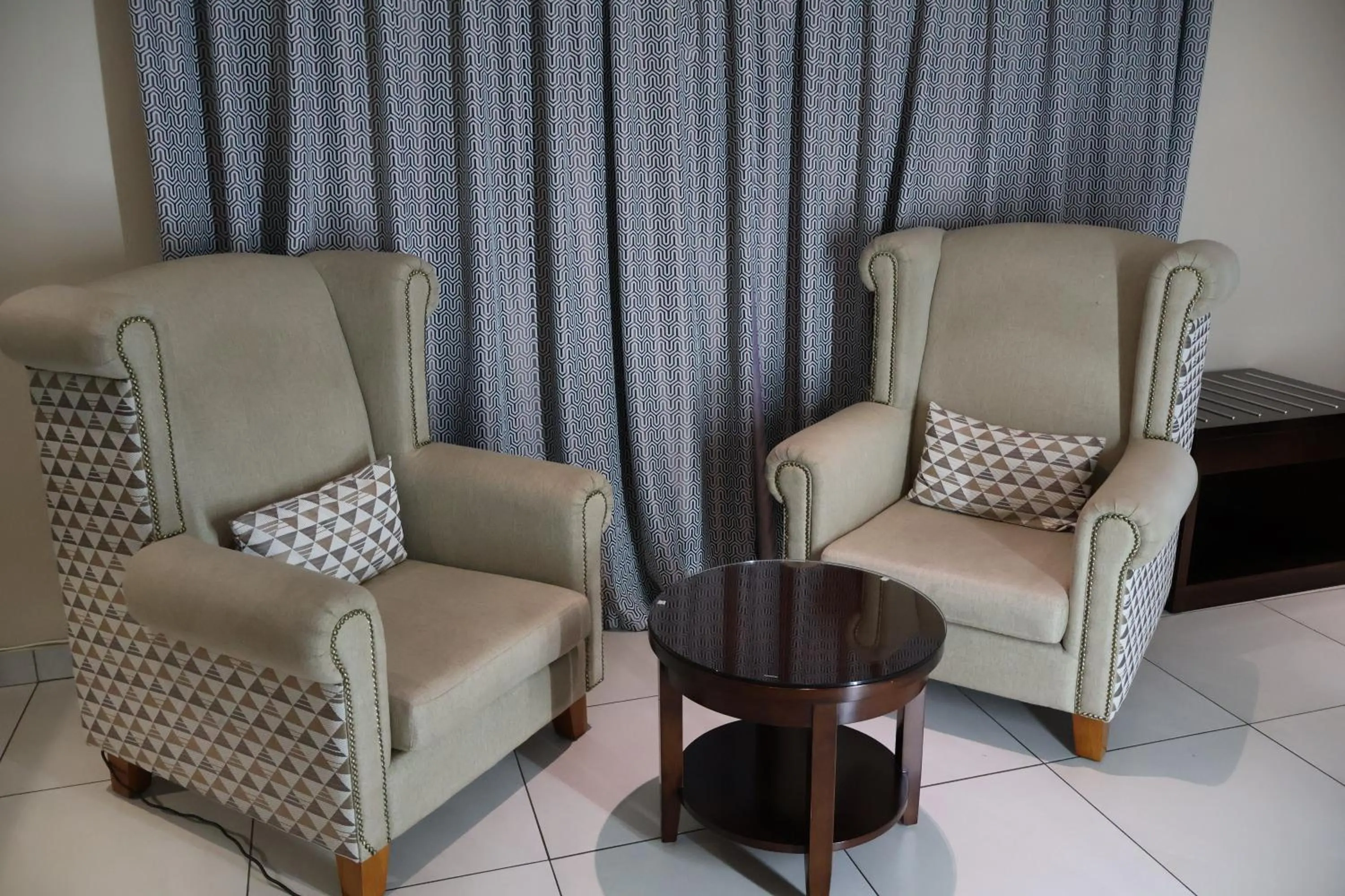 Seating area in Airport Gardens Boutique Hotel