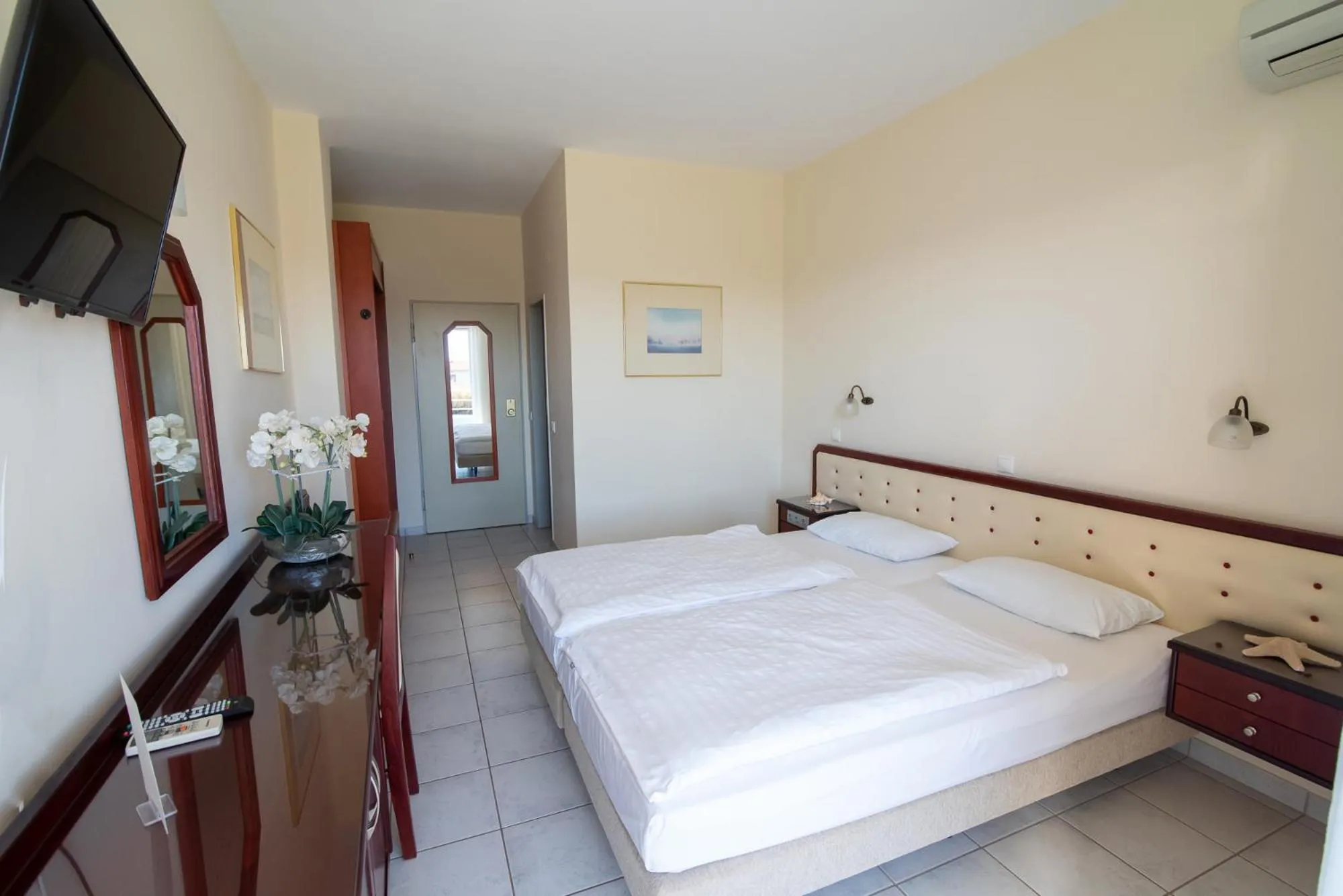 Bed in Dionisos Hotel