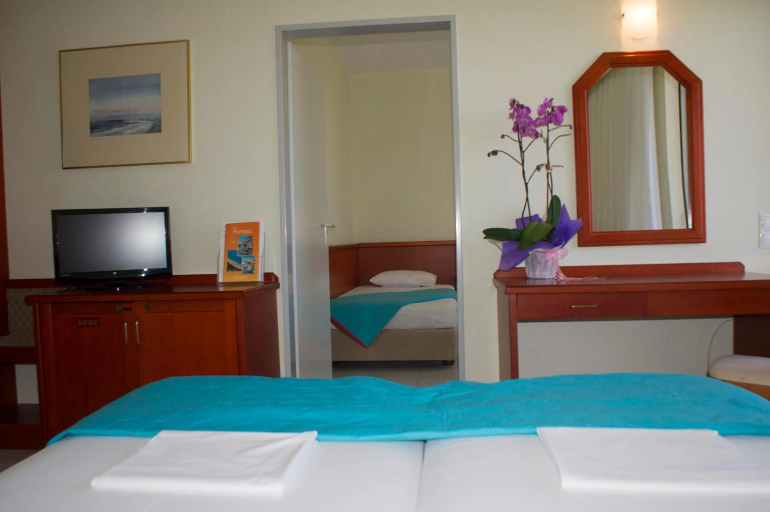 Bed in Dionisos Hotel