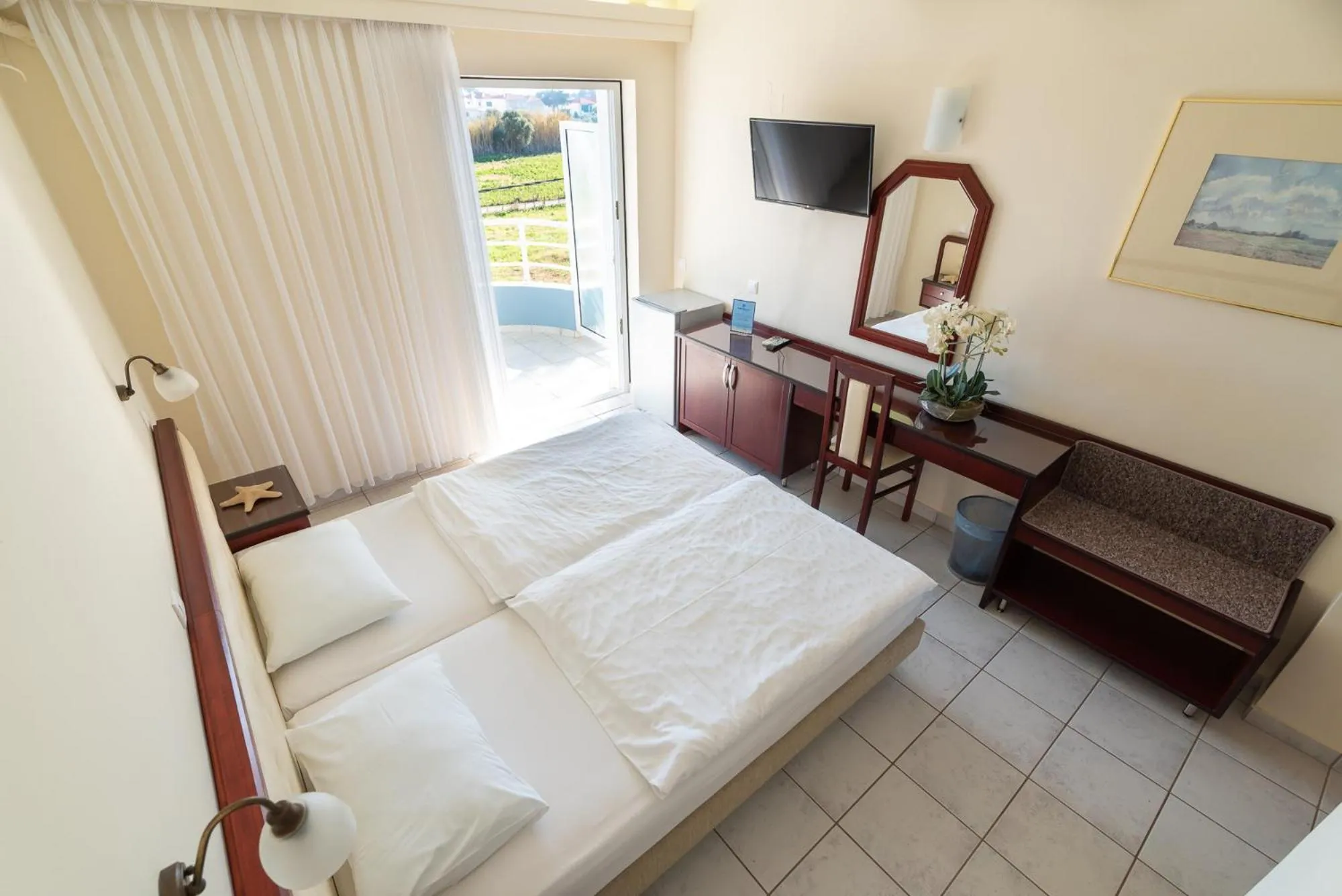 Bed in Dionisos Hotel