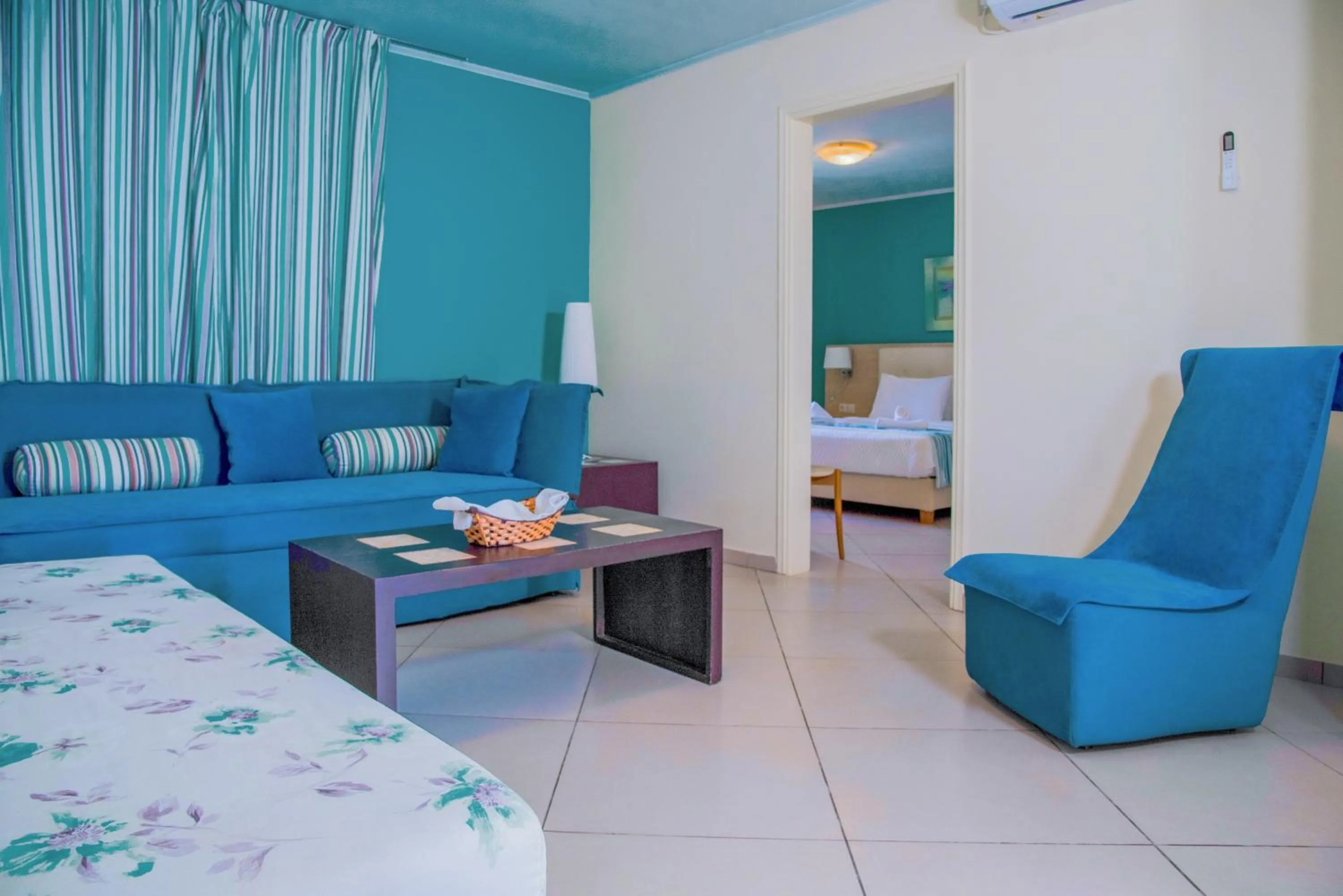 Living room, Bed in Princess Hotel