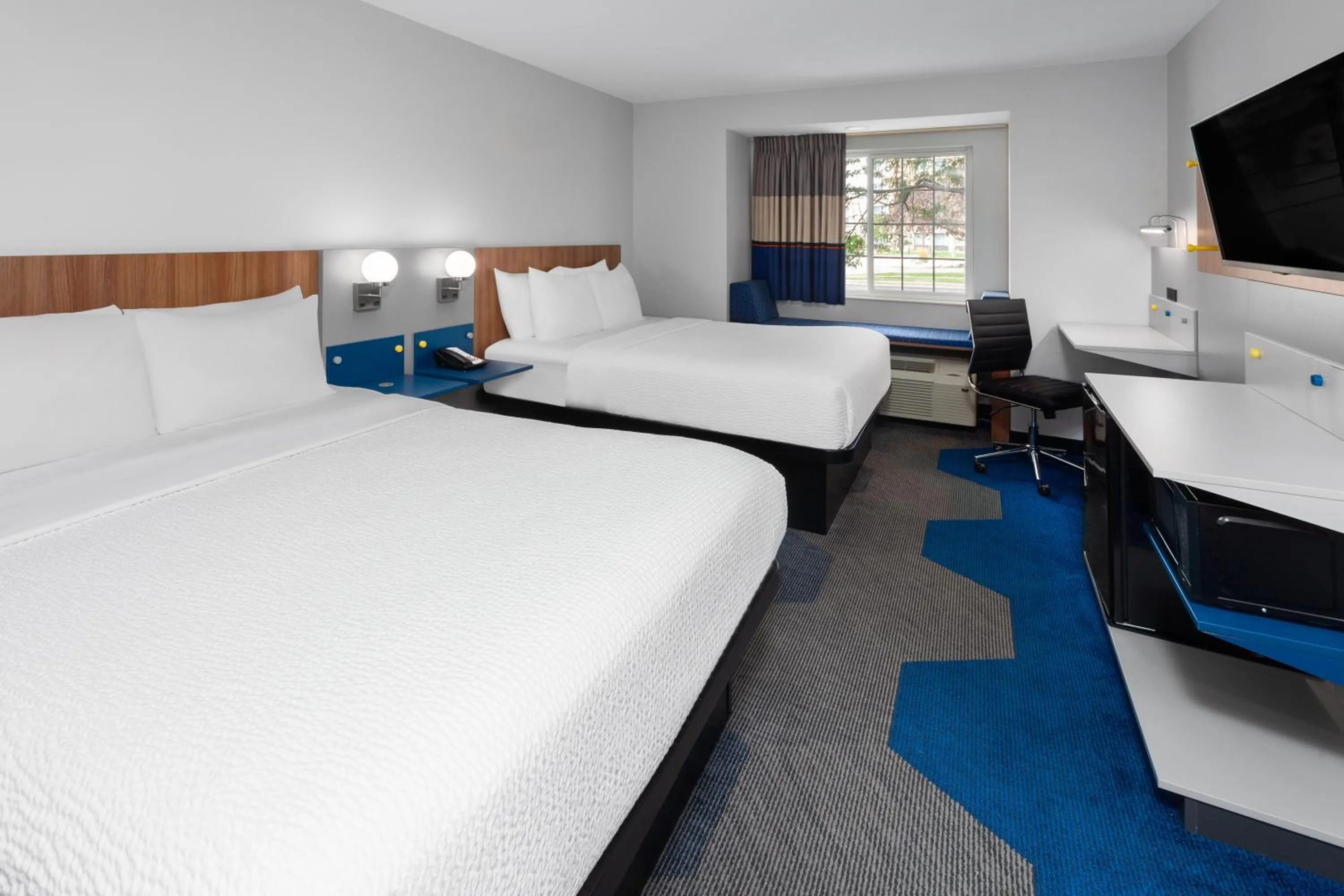 Bed in Microtel Inn by Wyndham Janesville