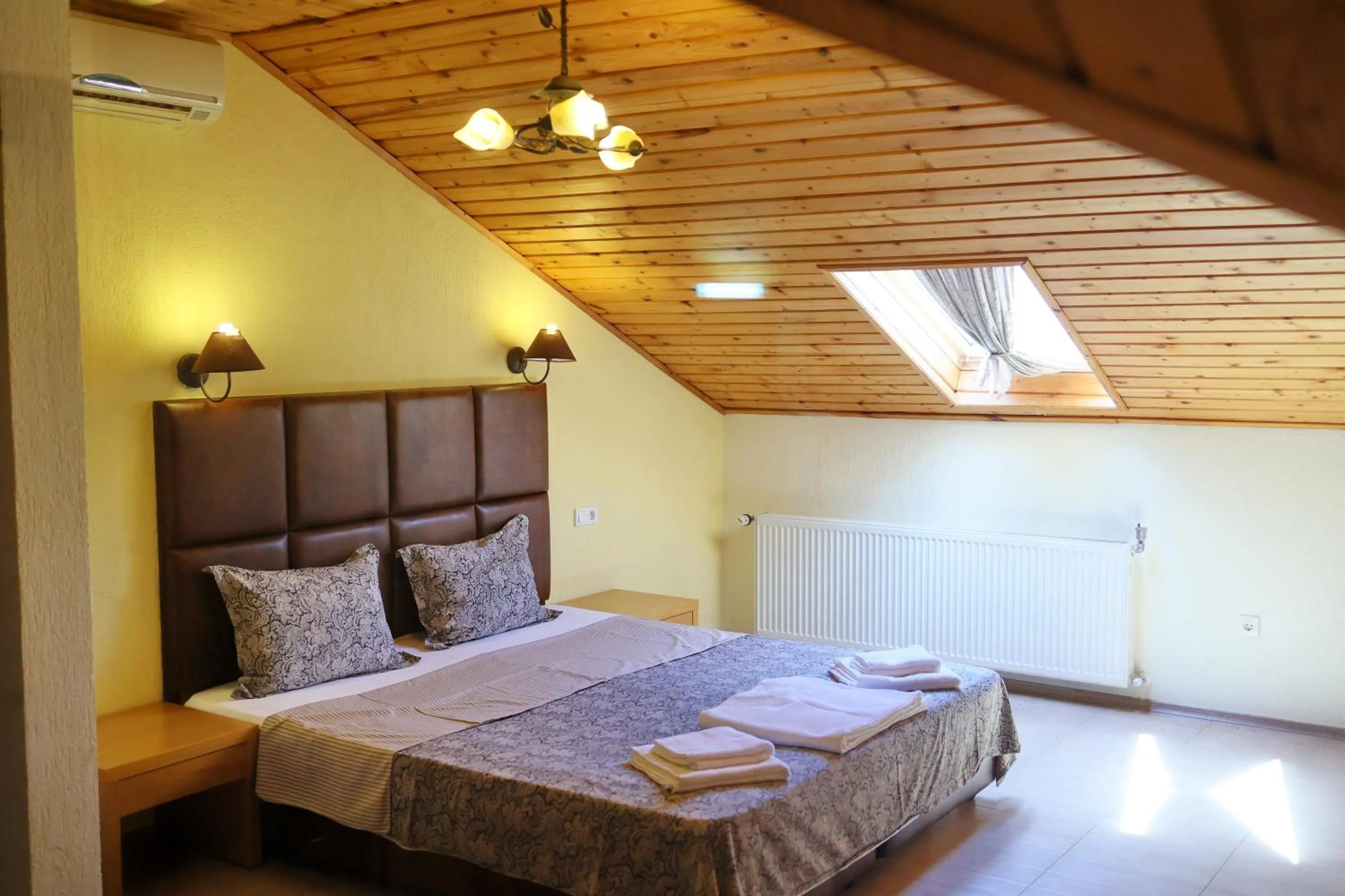 Bed in Elli Greco Hotel