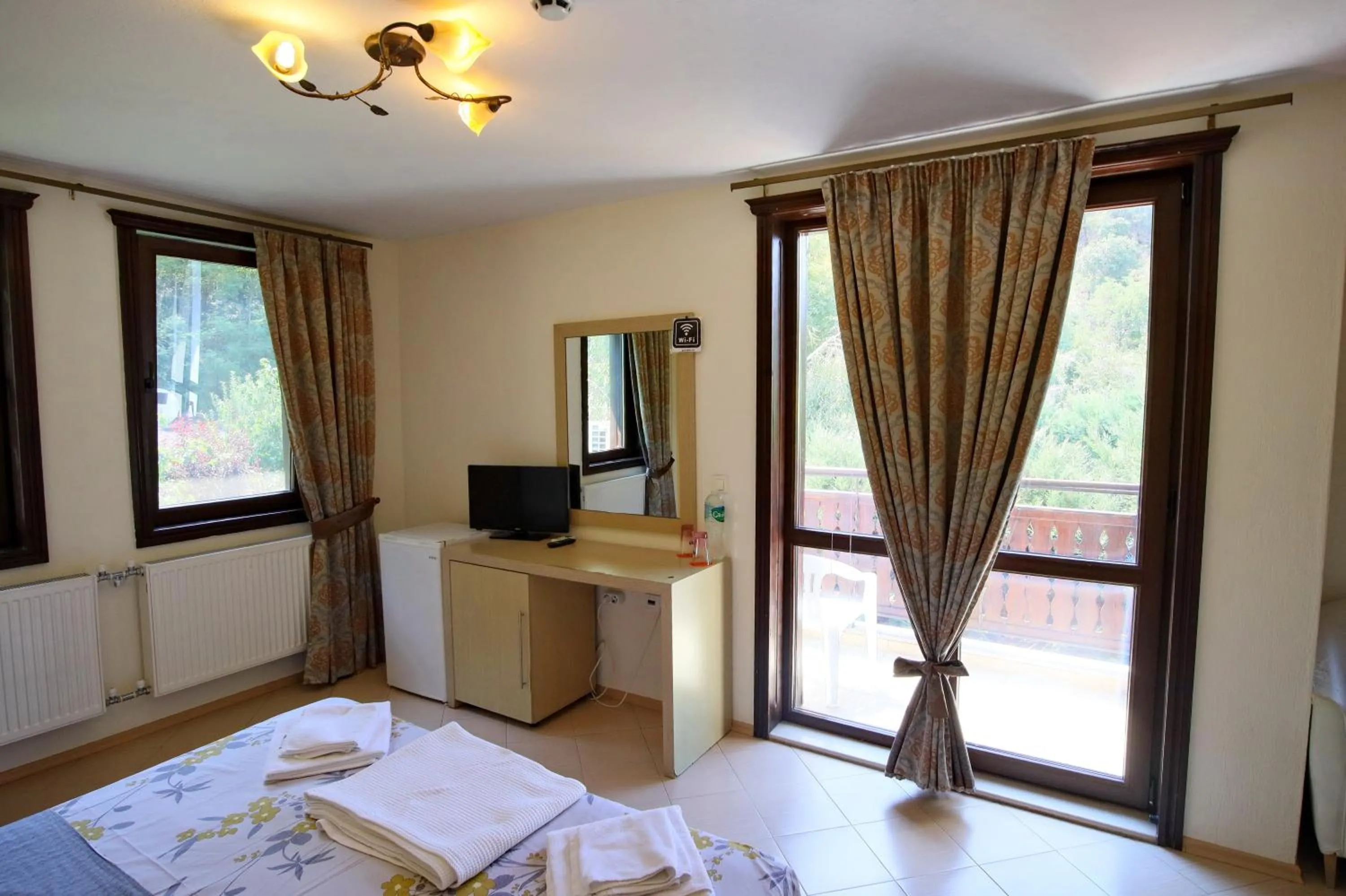 Bed in Elli Greco Hotel