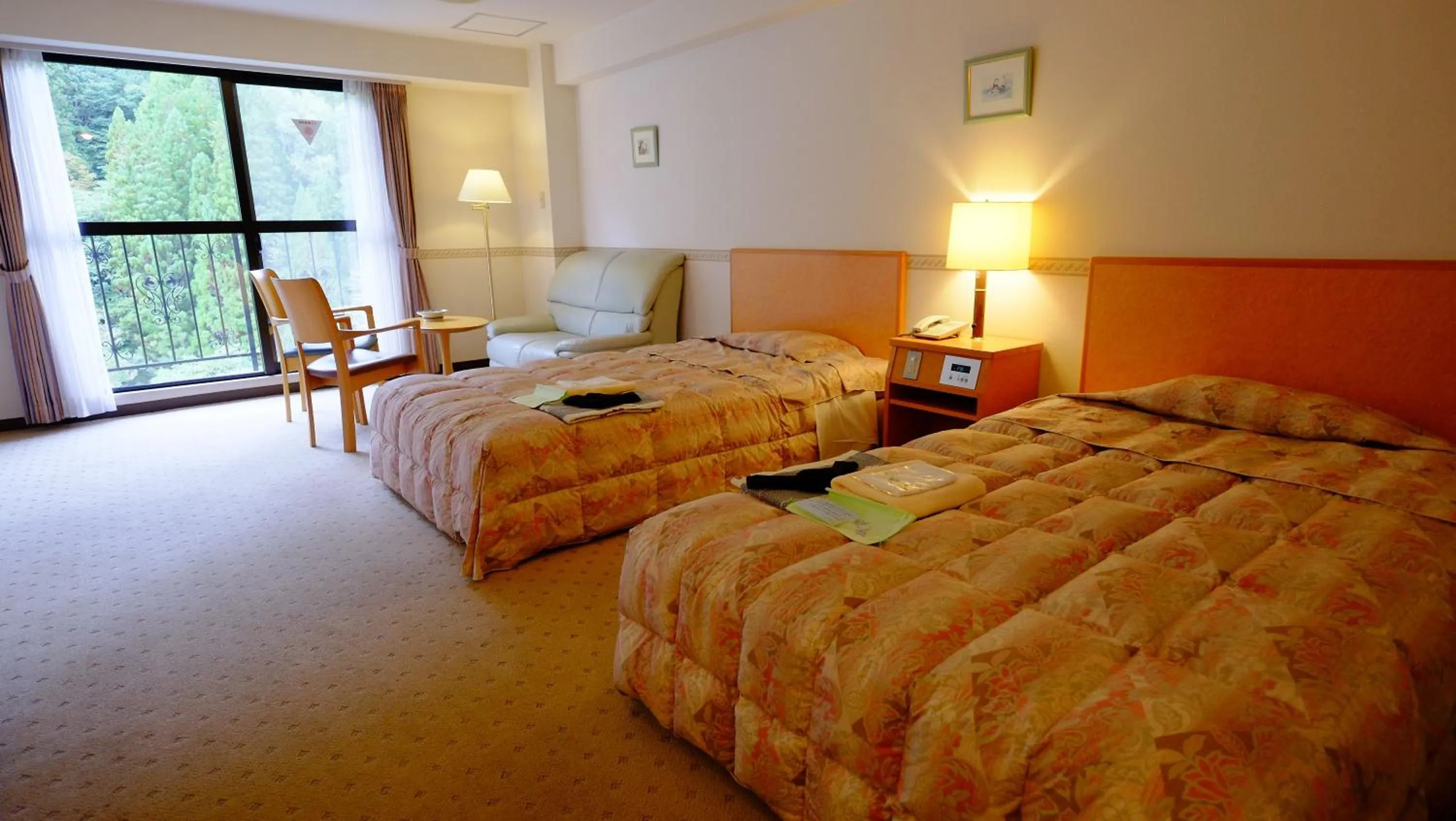 Bed in Okuhida Garden Hotel Yakedake