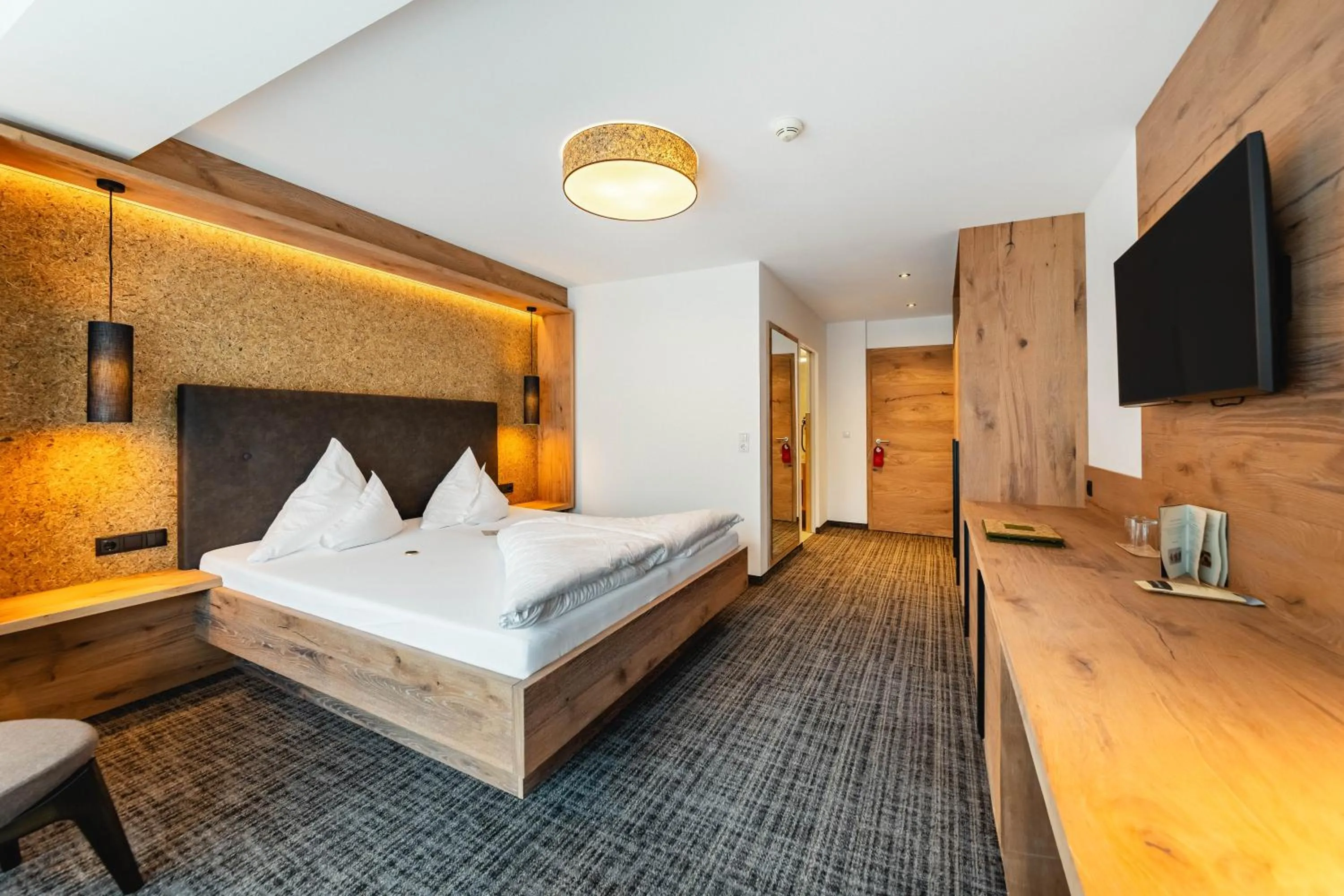 Photo of the whole room, Bed in Kräuterhotel Hochzillertal