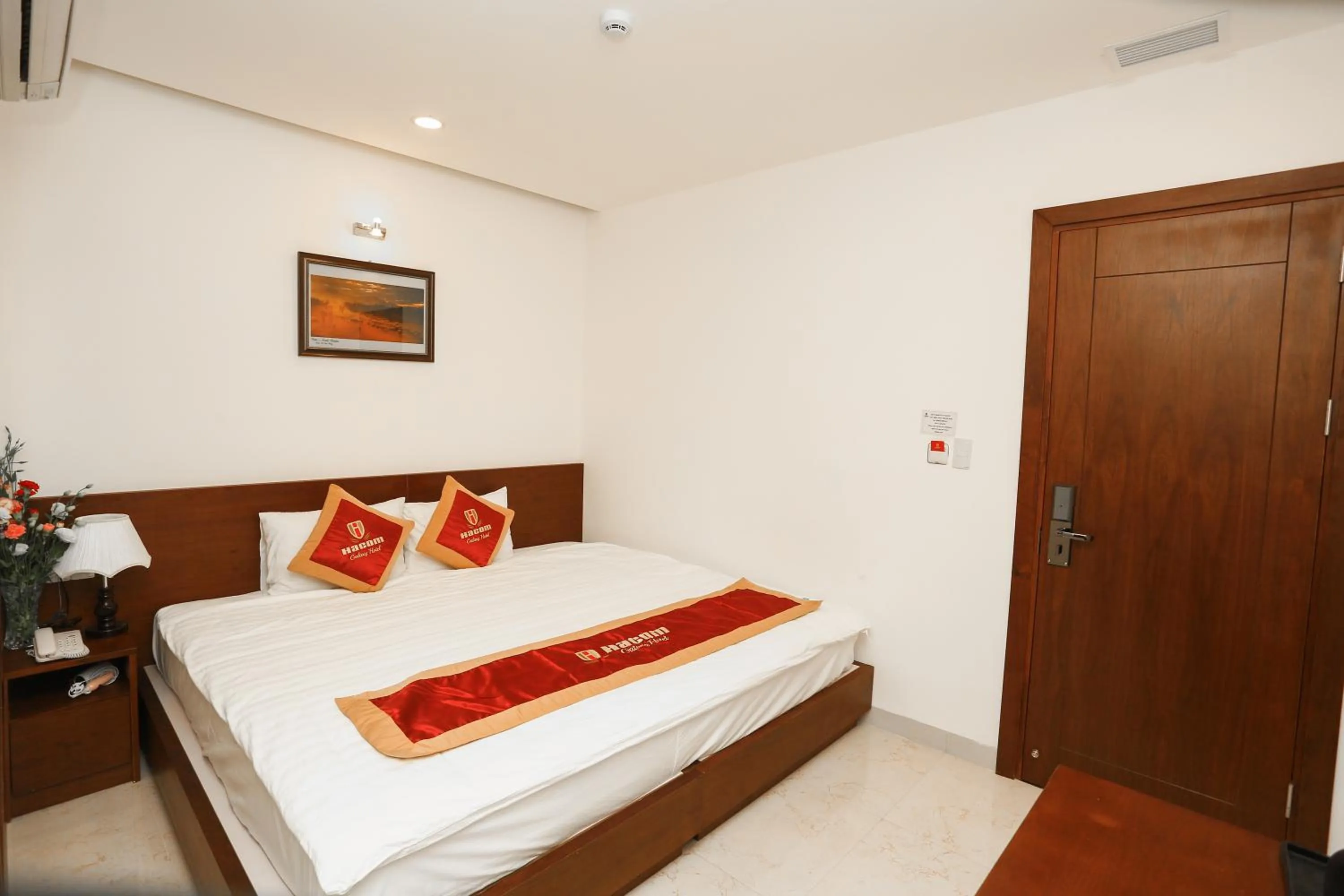 Bed in Hacom Galaxy Hotel