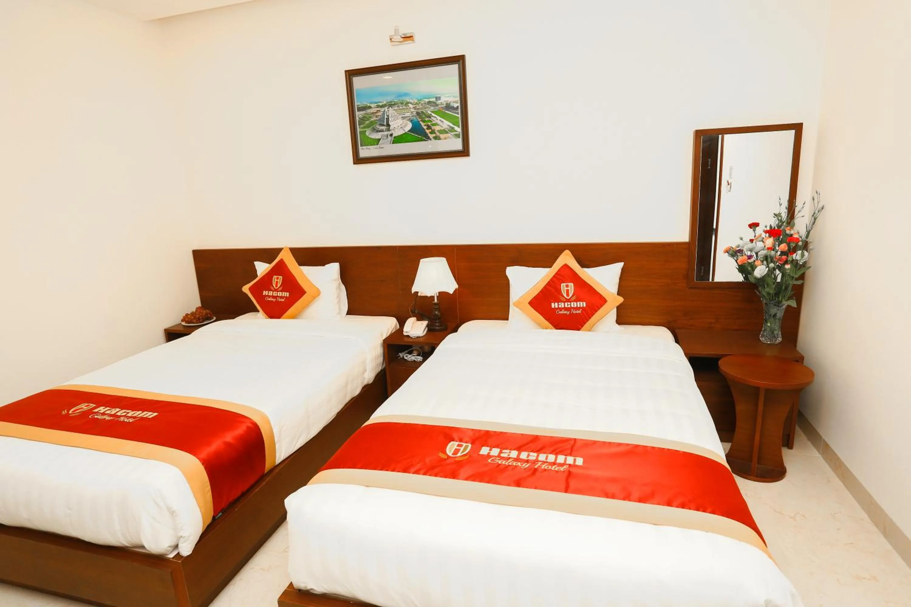 Bed in Hacom Galaxy Hotel