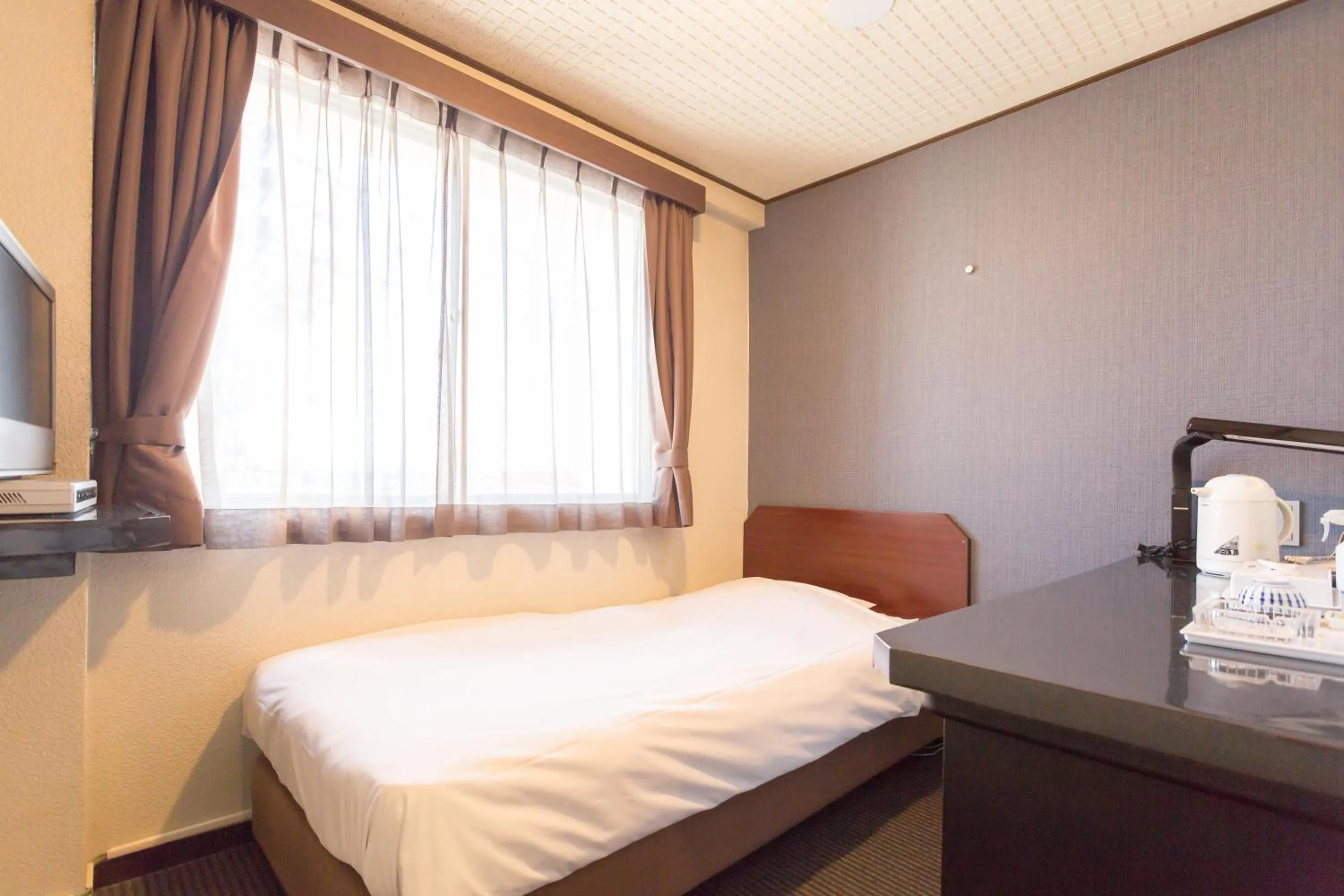 Bed in Shimizu City Hotel