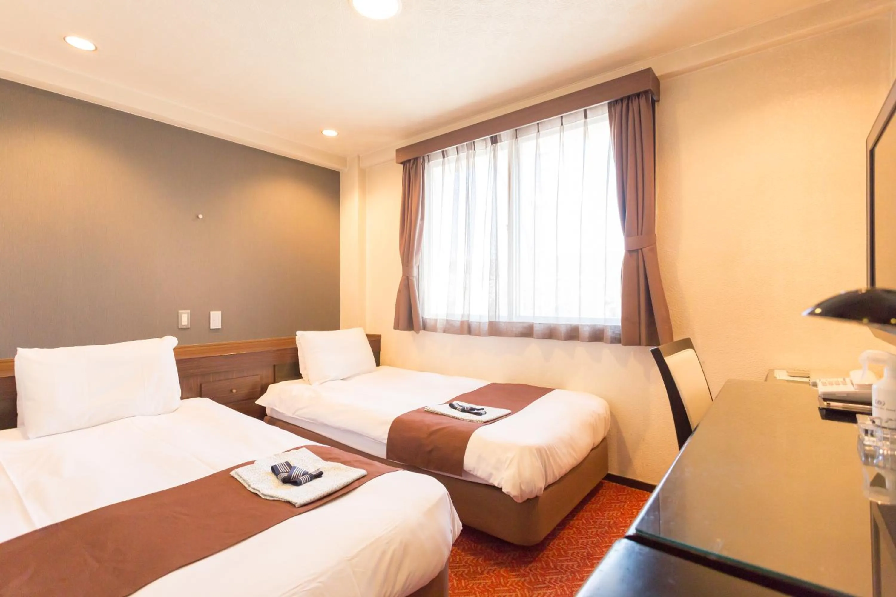 Bed in Shimizu City Hotel
