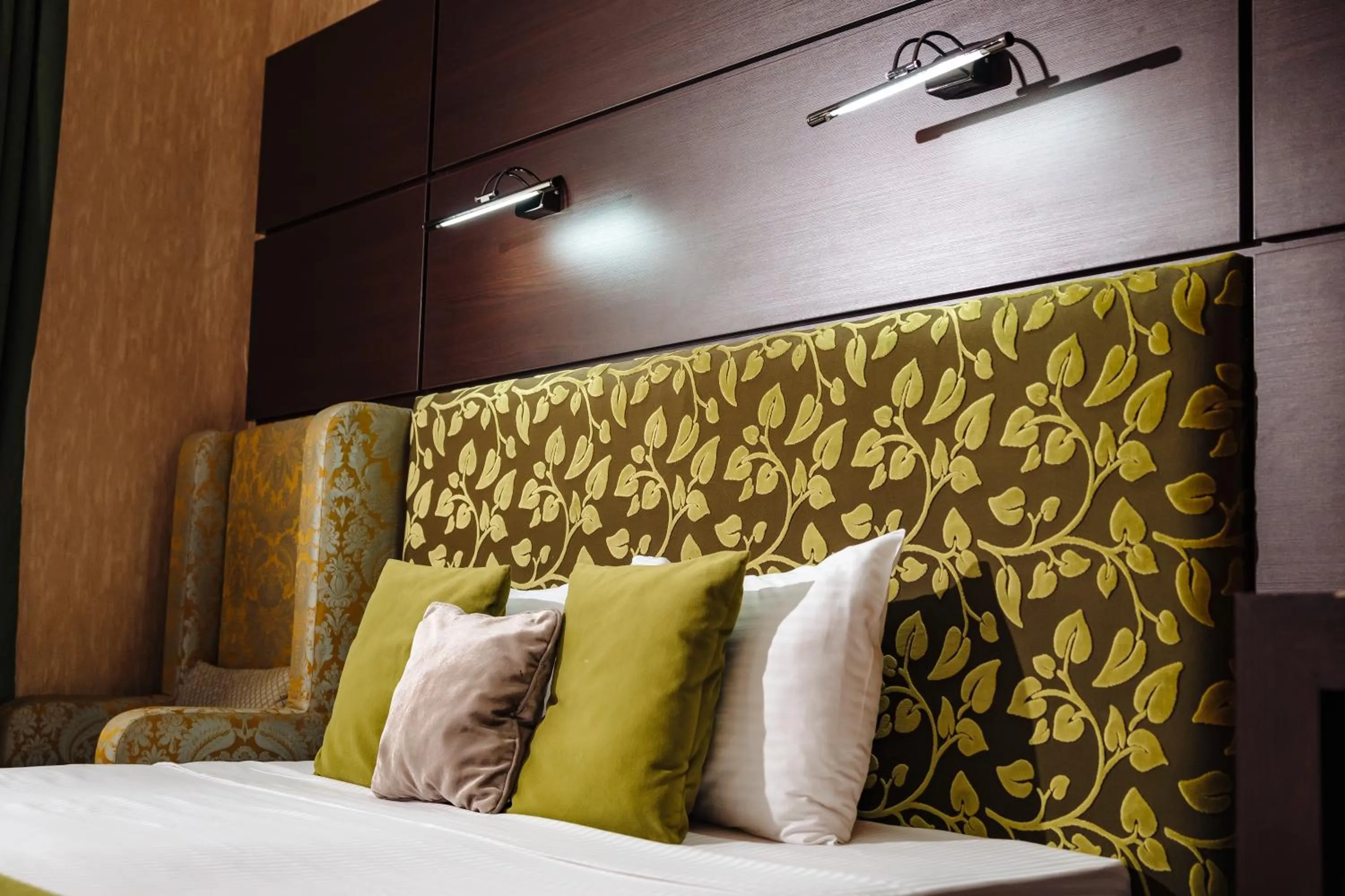 Bed in Maxim Pasha Hotel