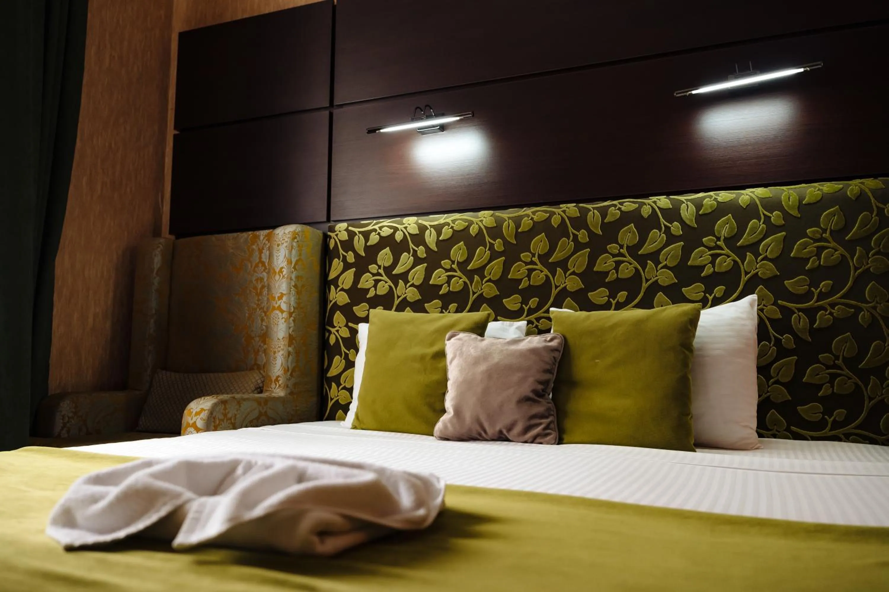 Bed in Maxim Pasha Hotel