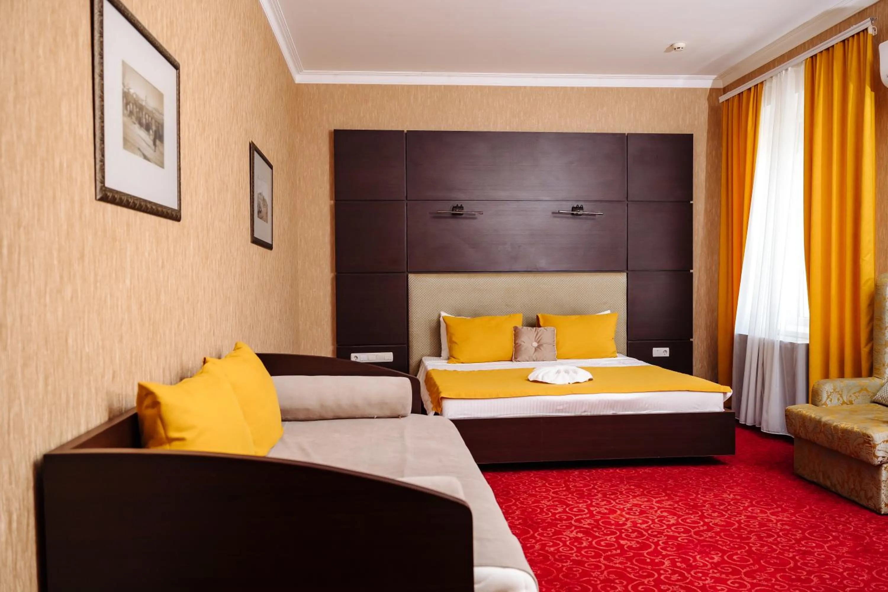 Bed in Maxim Pasha Hotel