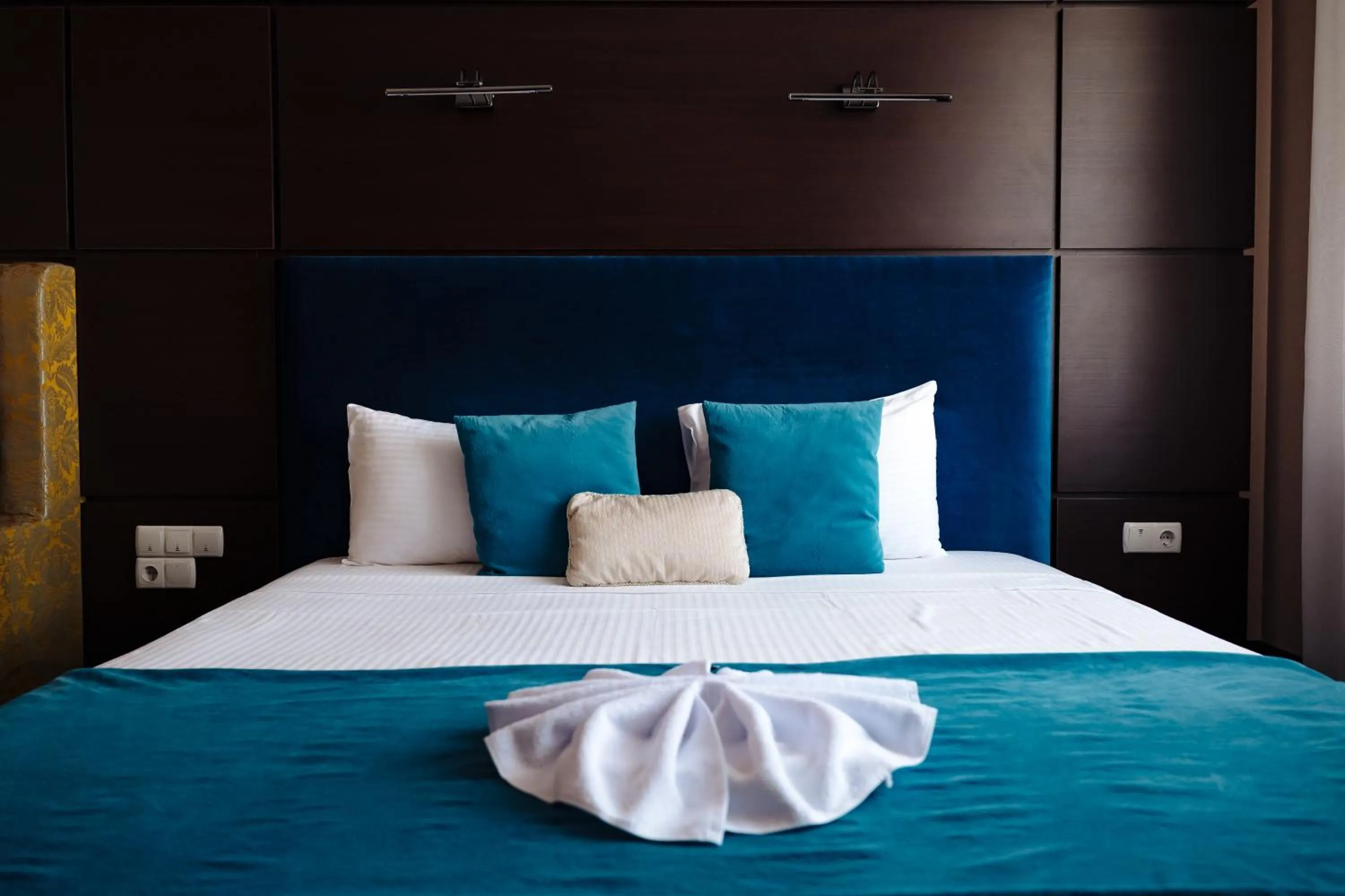 Bed in Maxim Pasha Hotel