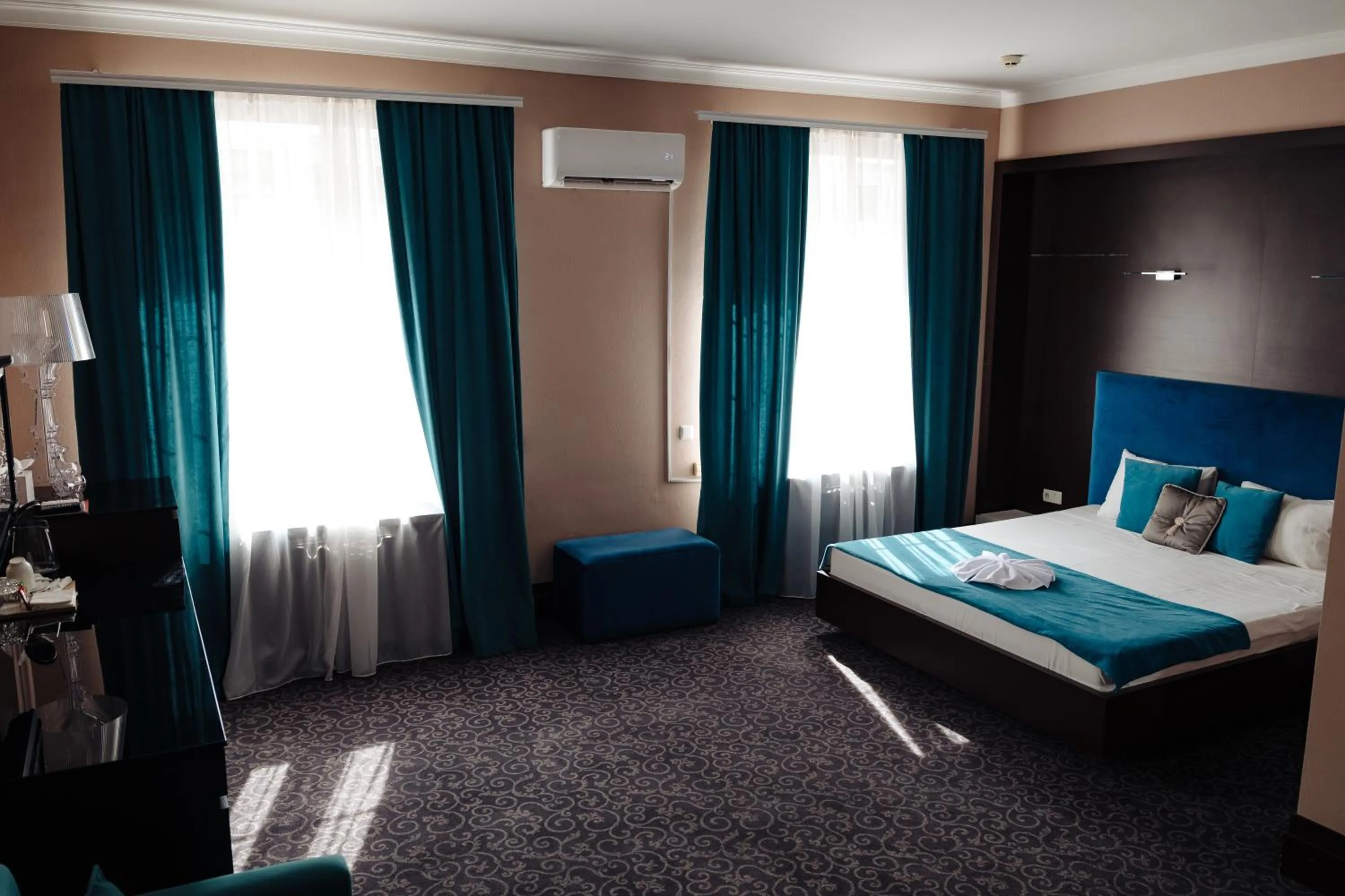 Bed in Maxim Pasha Hotel