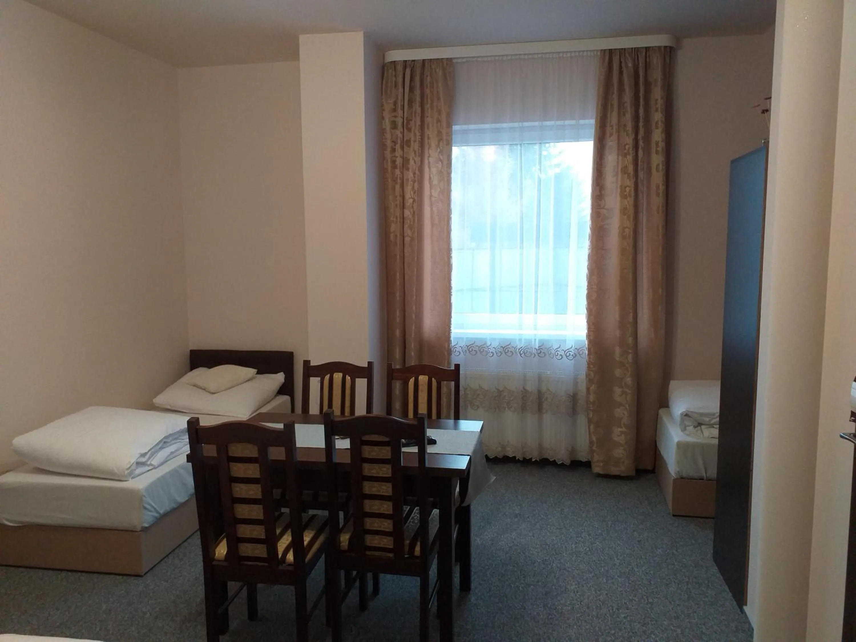 Economy Quadruple Room - single occupancy in Sum Restauracja & Hotel