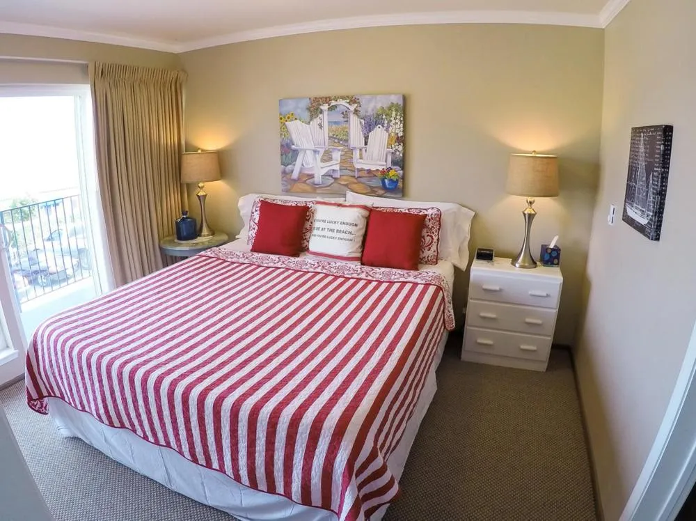 Bed in Capitola Beach Suites