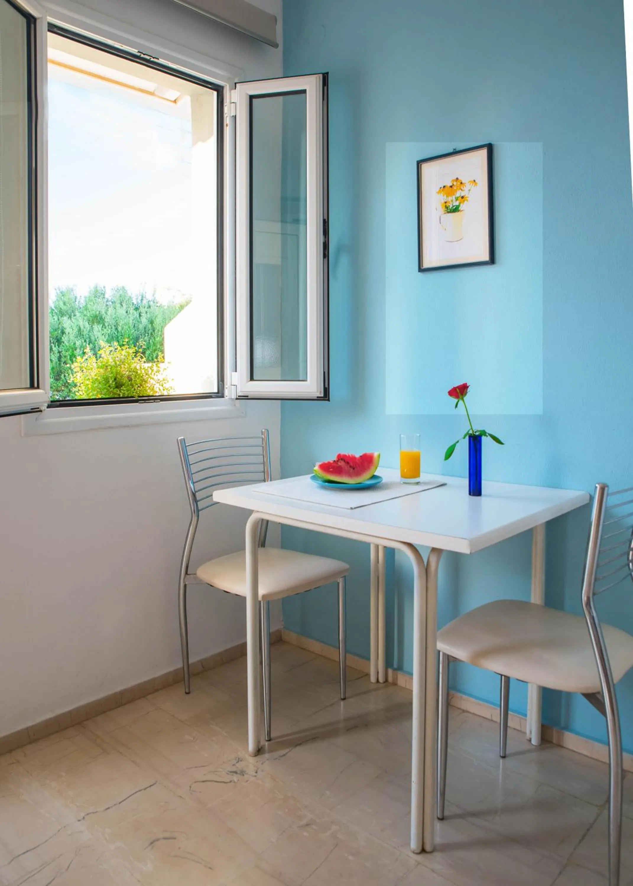 Seating area in Melissa Apartments, Studios & Suites