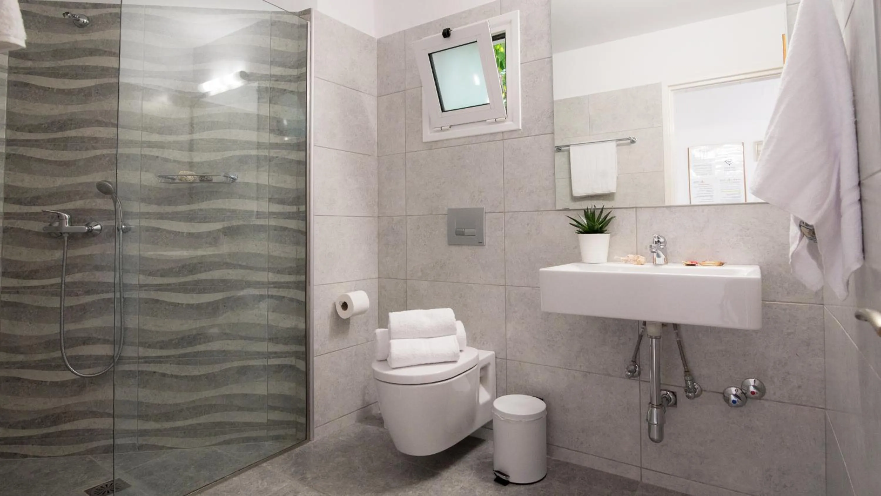 Bathroom in Melissa Apartments, Studios & Suites