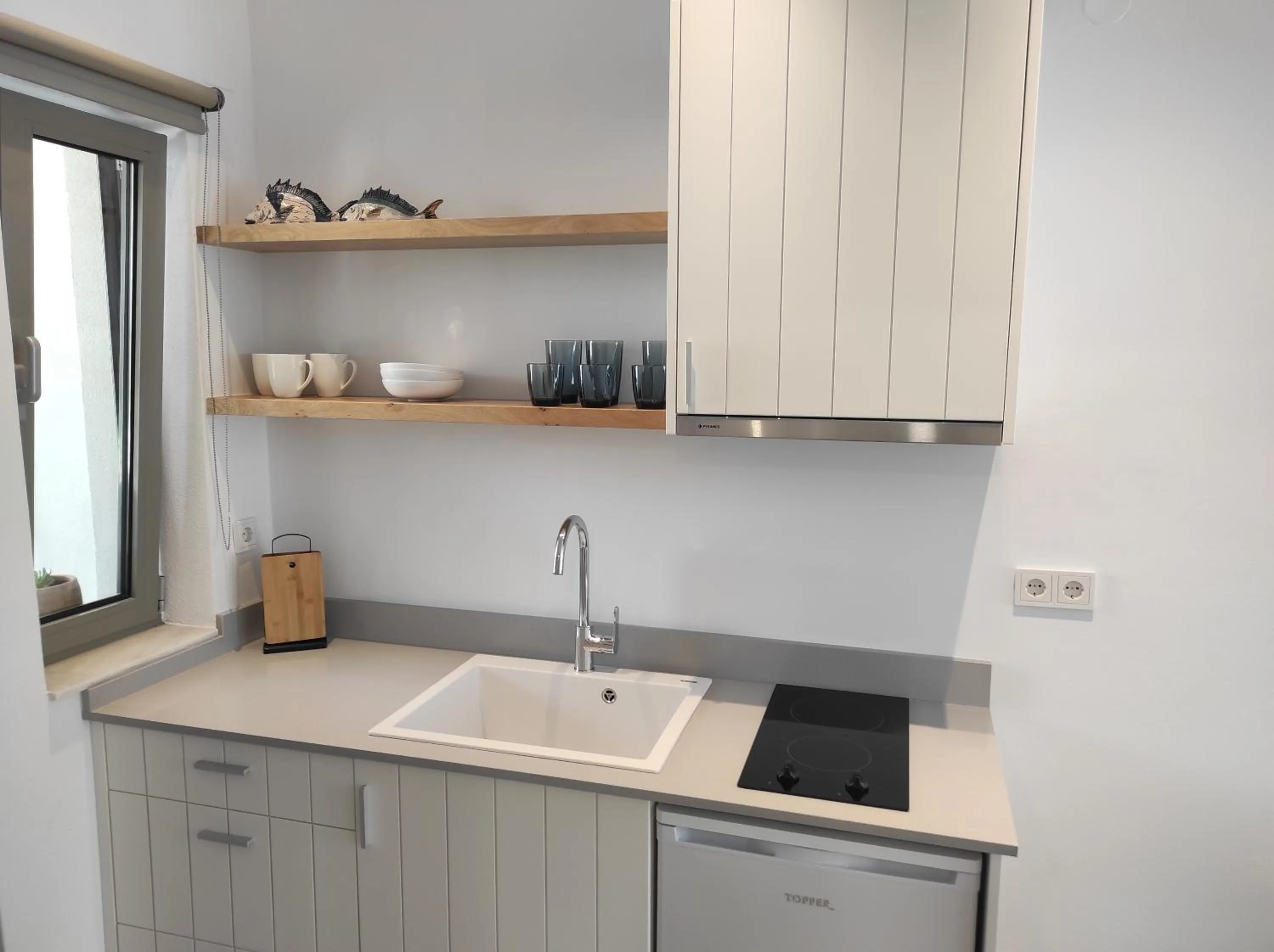 Kitchen or kitchenette in Melissa Apartments, Studios & Suites