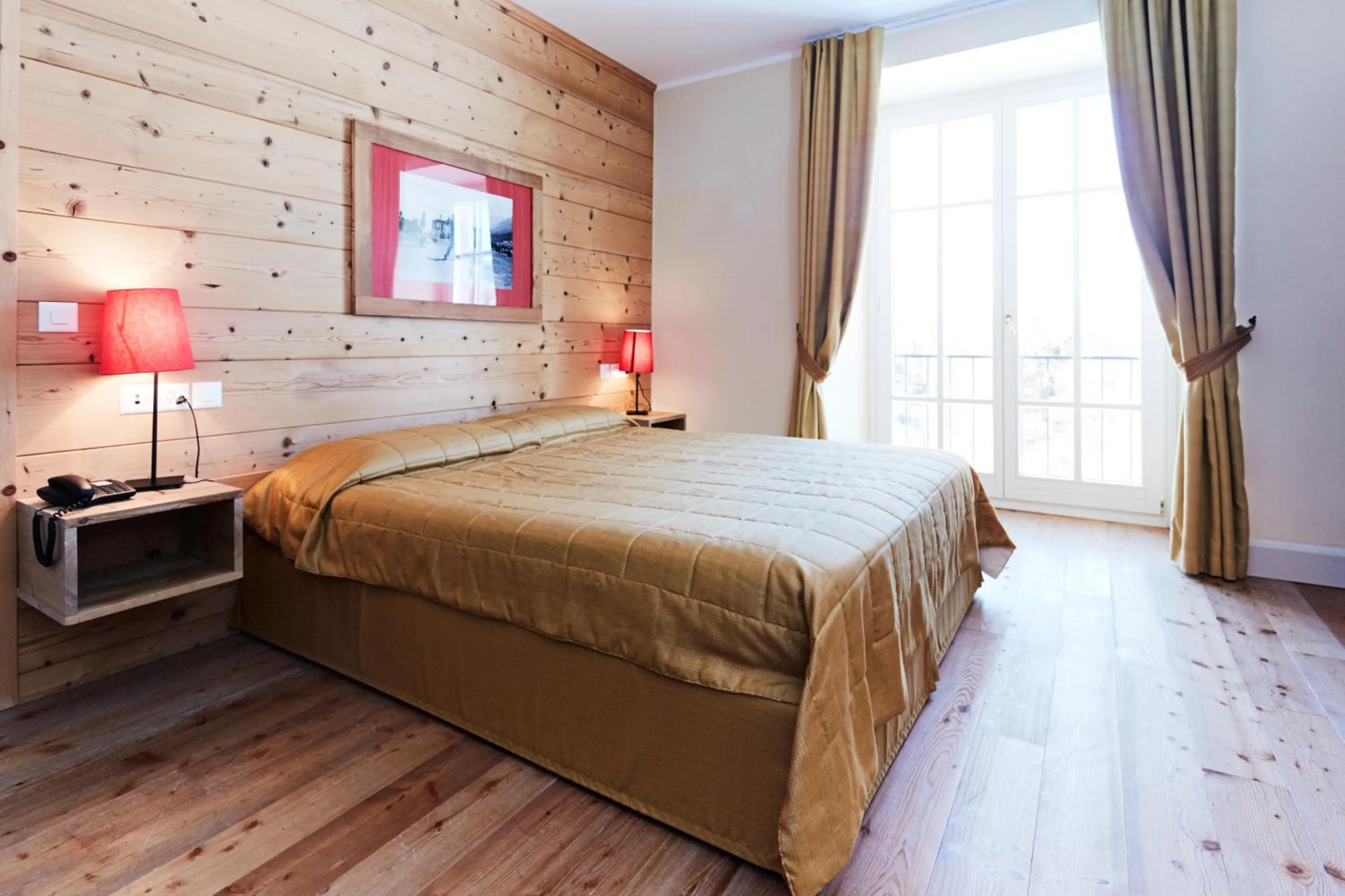 Bed in Maloja Palace Suites CO2-Neutral