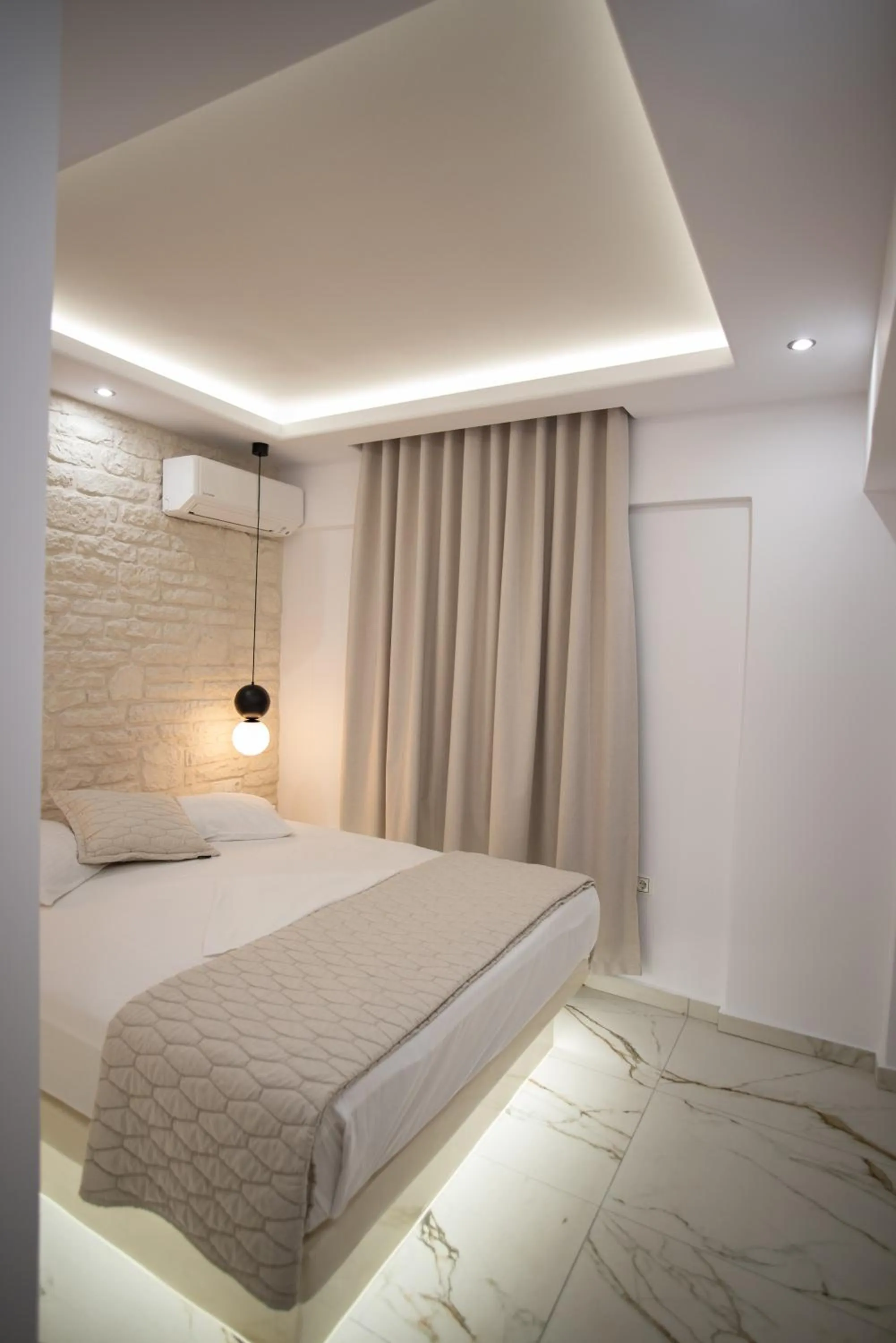 Bed in Katerina Roza Studios - Heartfelt Hospitality in the City