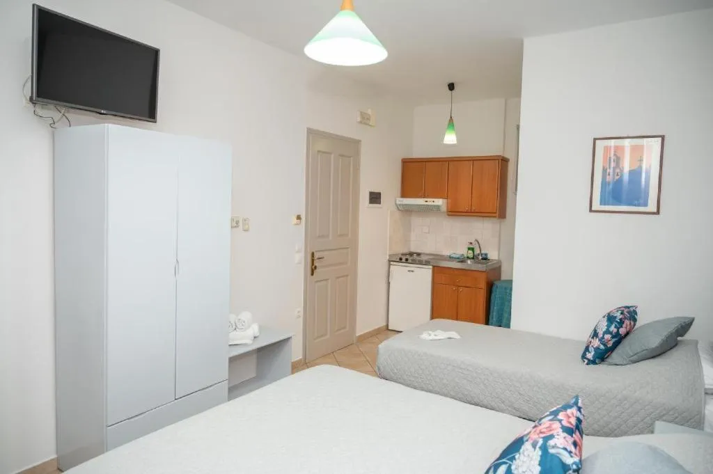 Bed in Katerina Roza Studios - Heartfelt Hospitality in the City