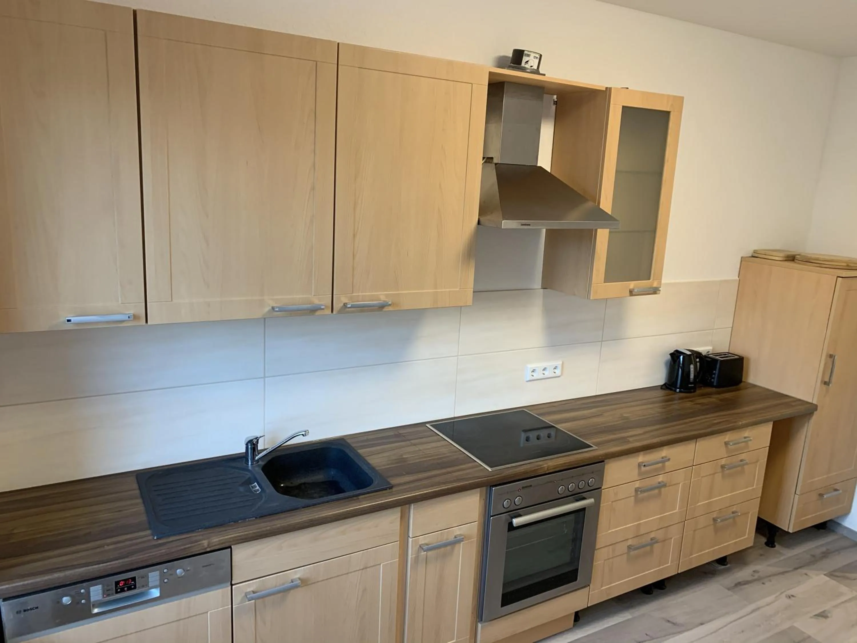 Kitchen or kitchenette in Apart-Hotel Rheinischer Hof Dormagen