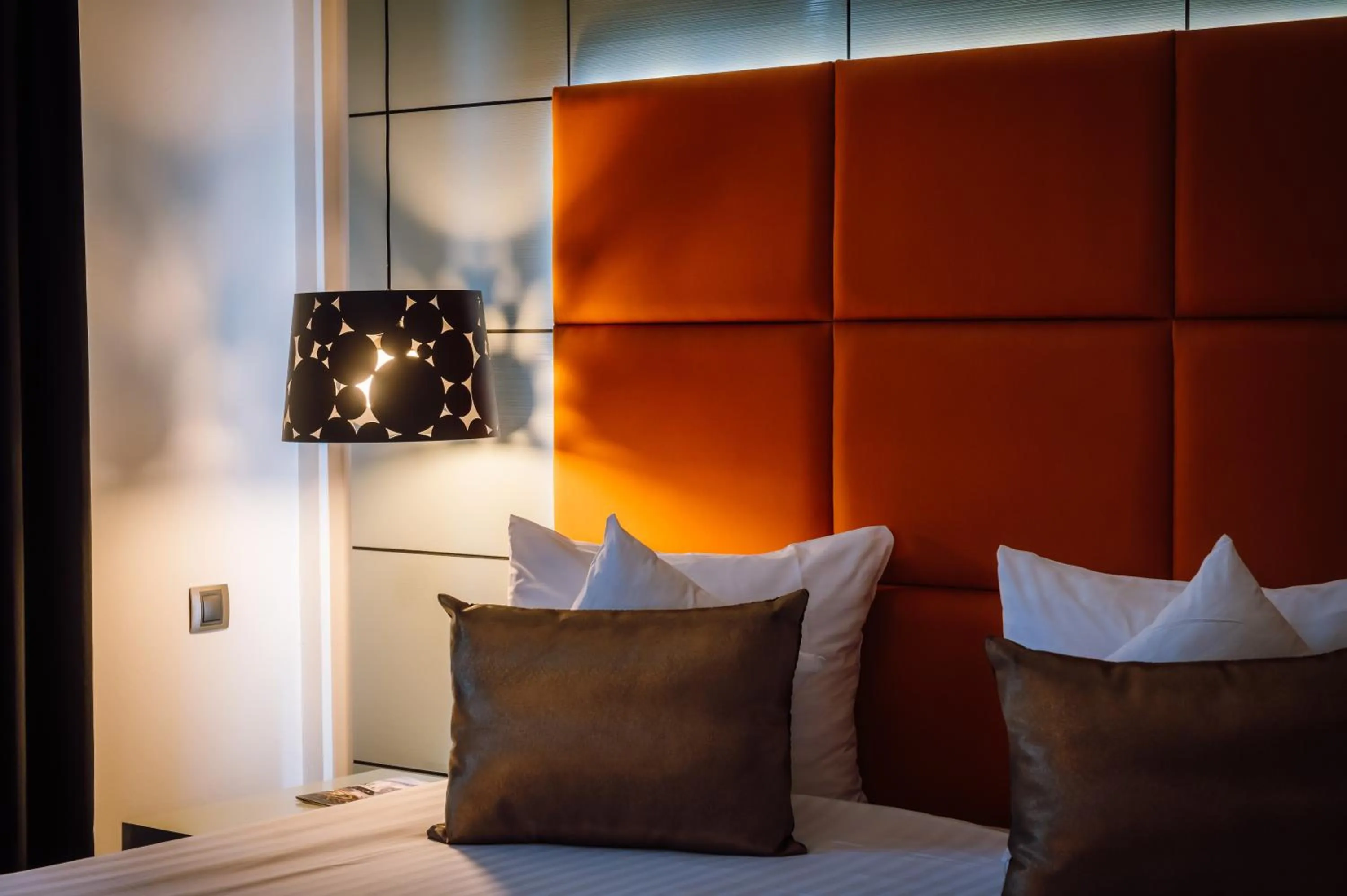 Bed in Plaza V Hotel