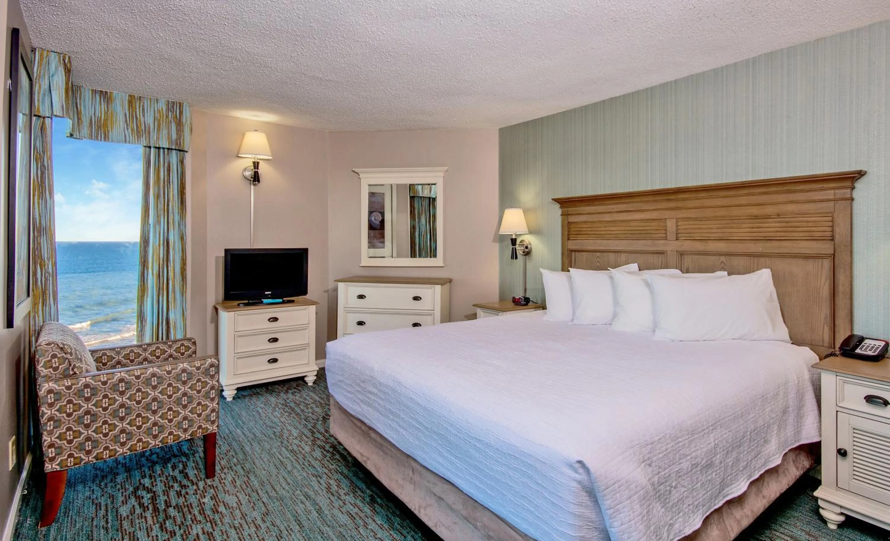 Bedroom, Bed in The Strand - A Boutique Resort