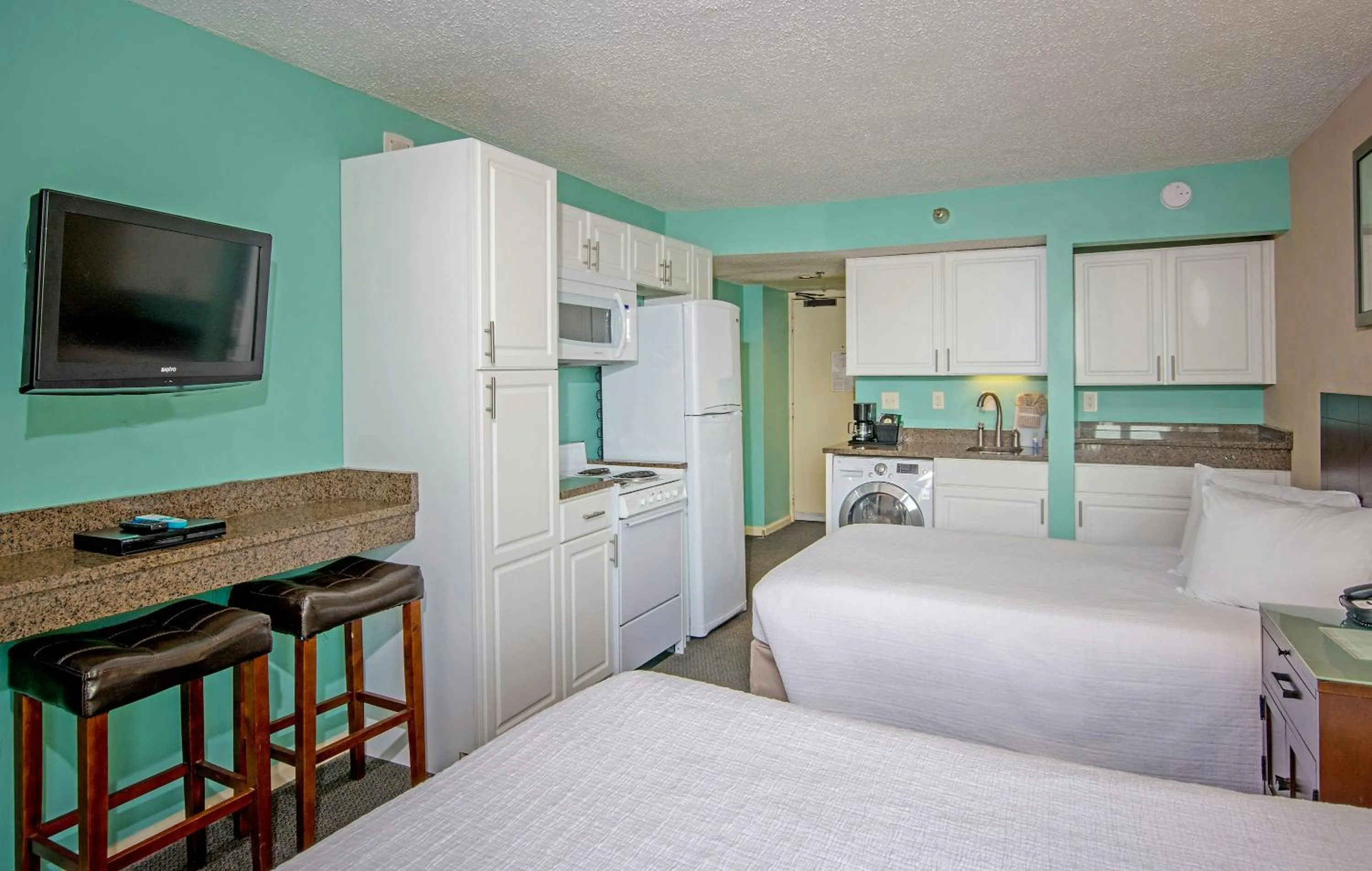 Bedroom, Bed in The Strand - A Boutique Resort