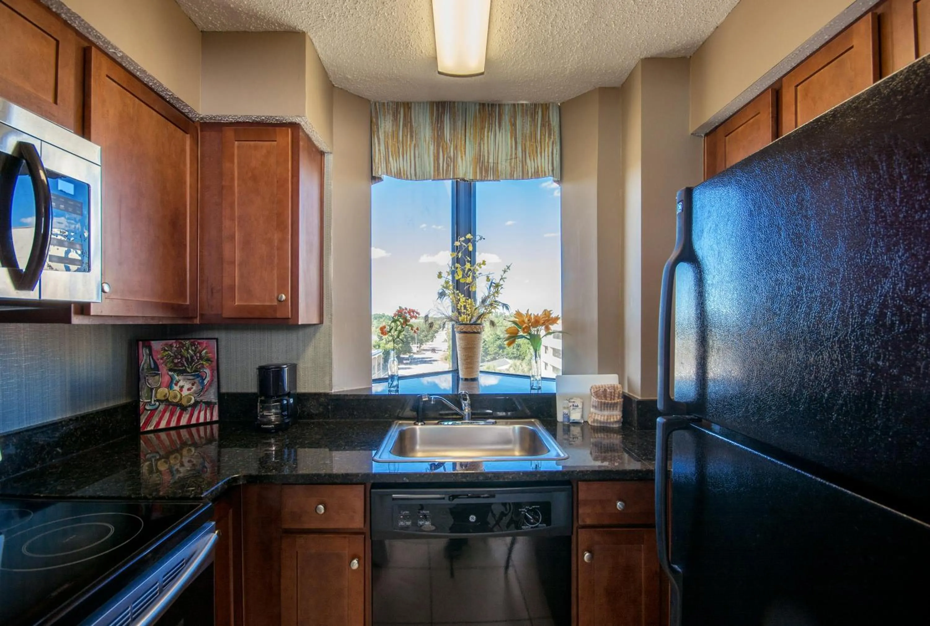 Kitchen or kitchenette in The Strand - A Boutique Resort