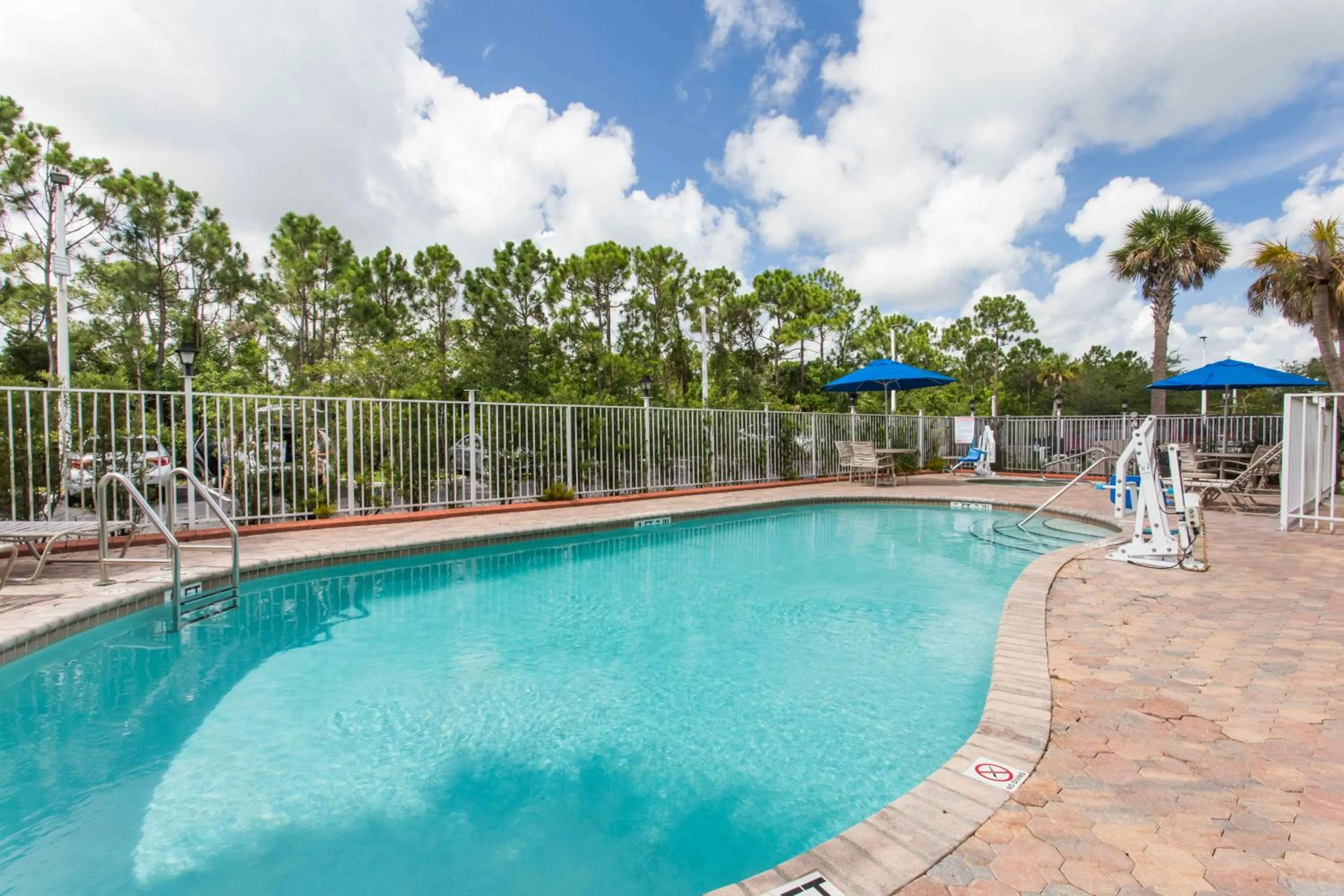 Swimming pool in Days Inn & Suites by Wyndham Fort Pierce I-95