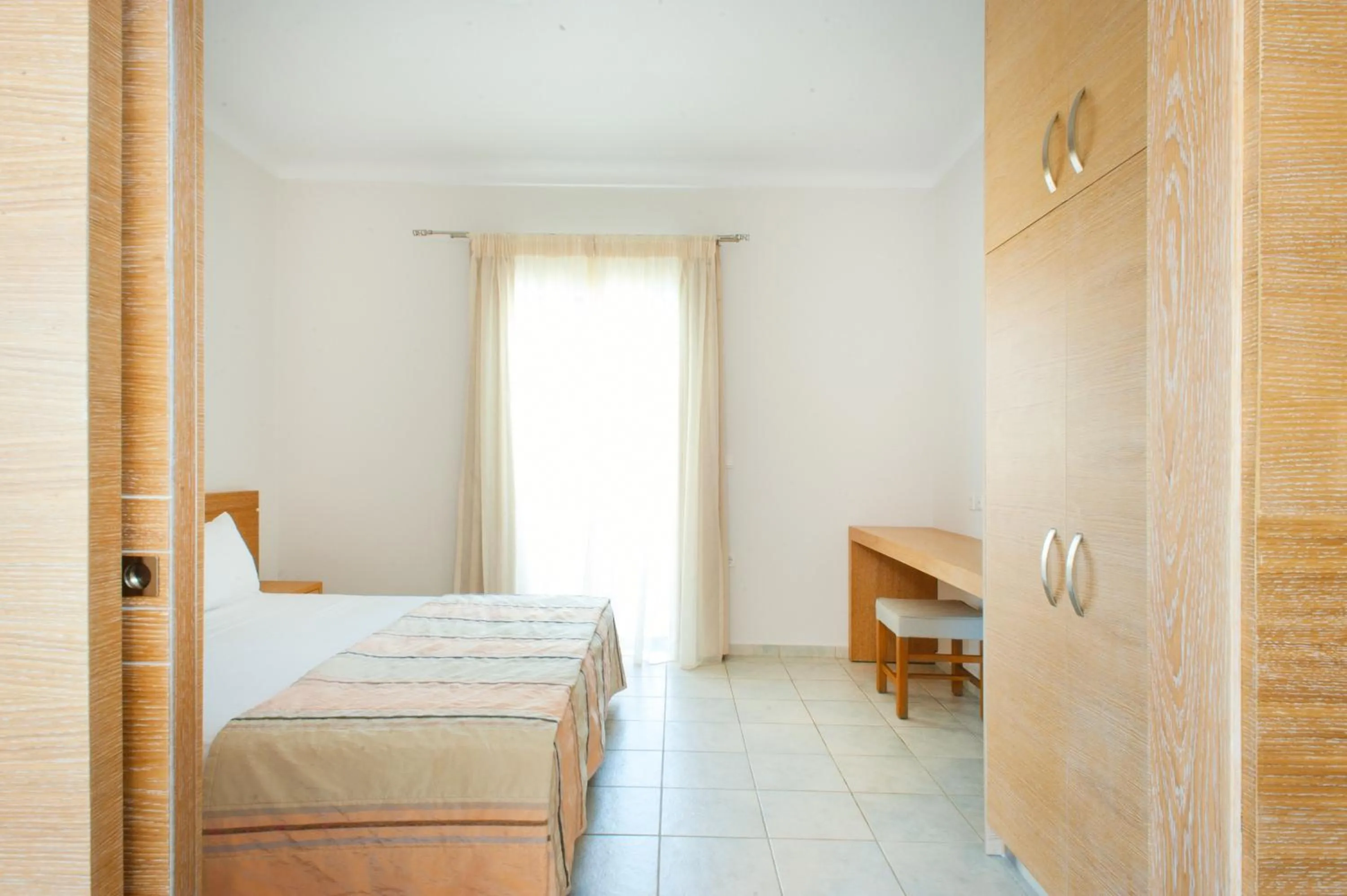Bed in Silver Beach Hotel & Apartments
