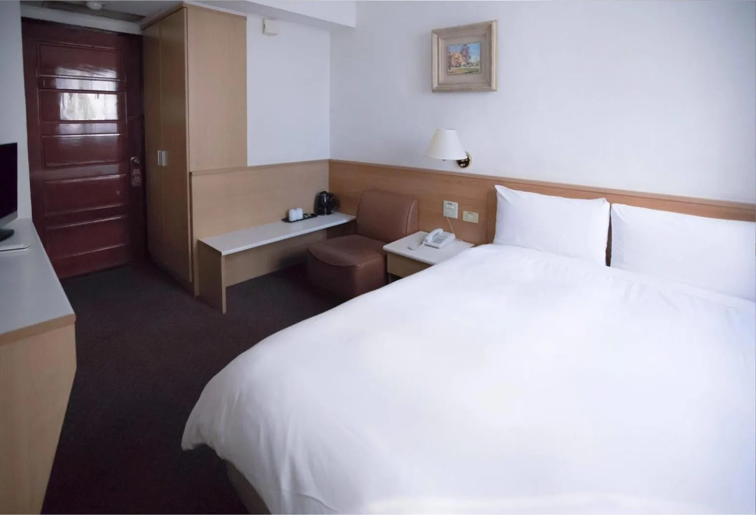 Bed in Tien Chin Hotel