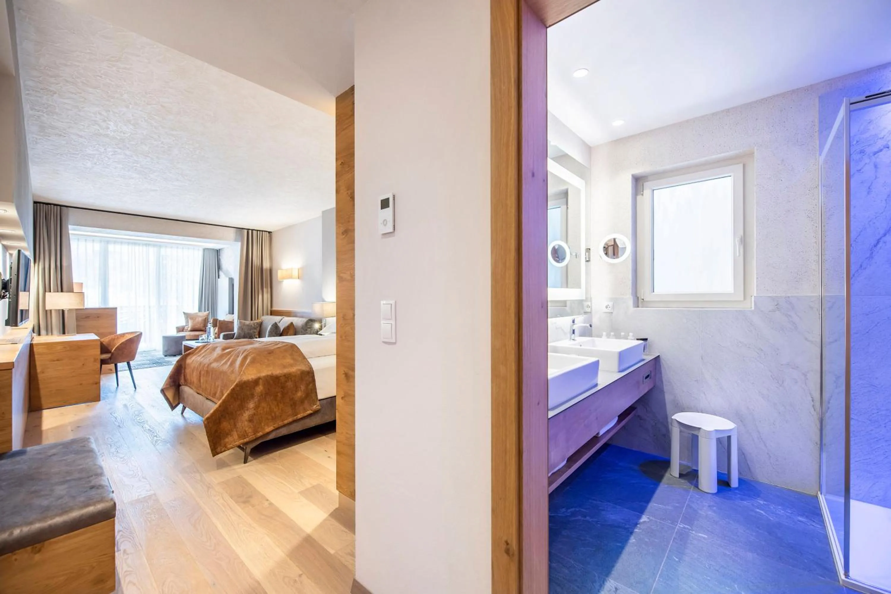 Bedroom, Bed in Quellenhof Luxury Resort Passeier