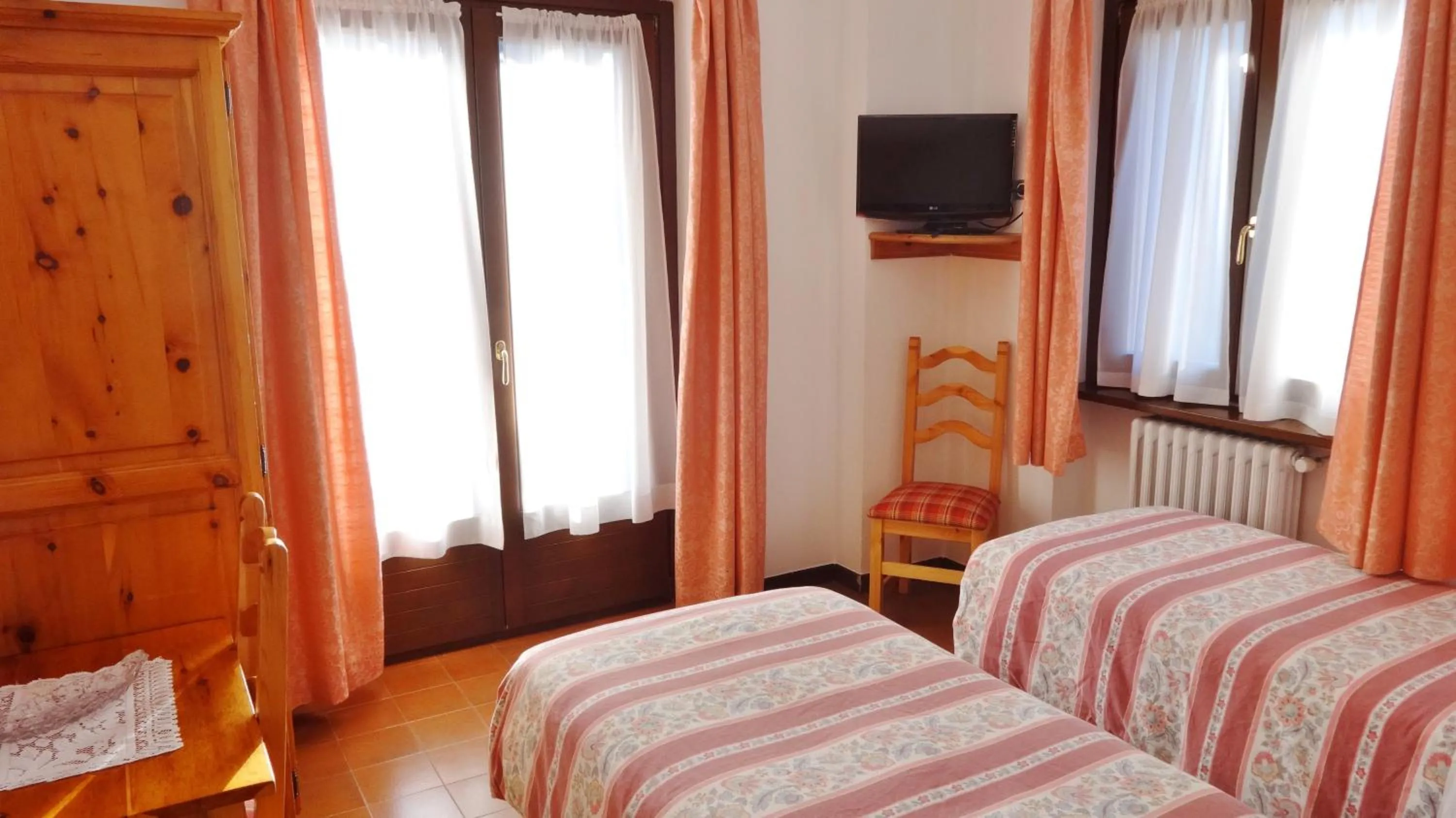 Bed in Hotel Piccolo Mondo