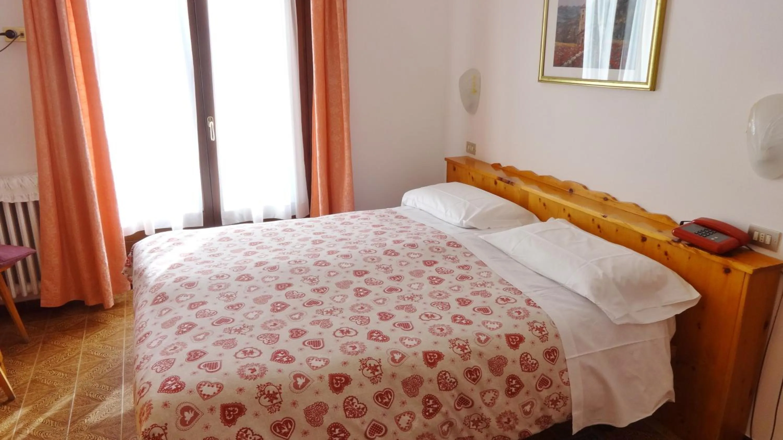 Bed in Hotel Piccolo Mondo