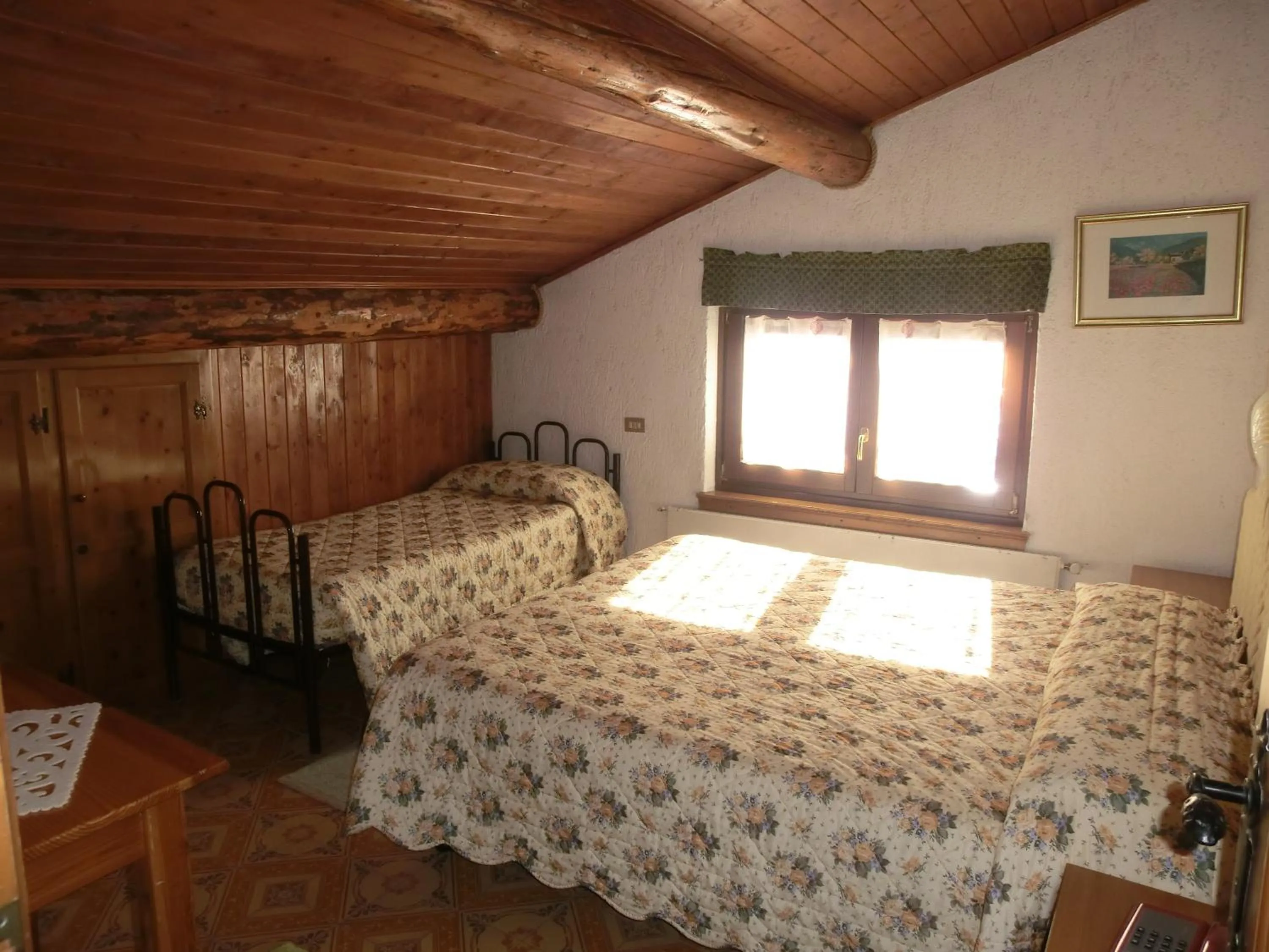 Bed in Hotel Piccolo Mondo