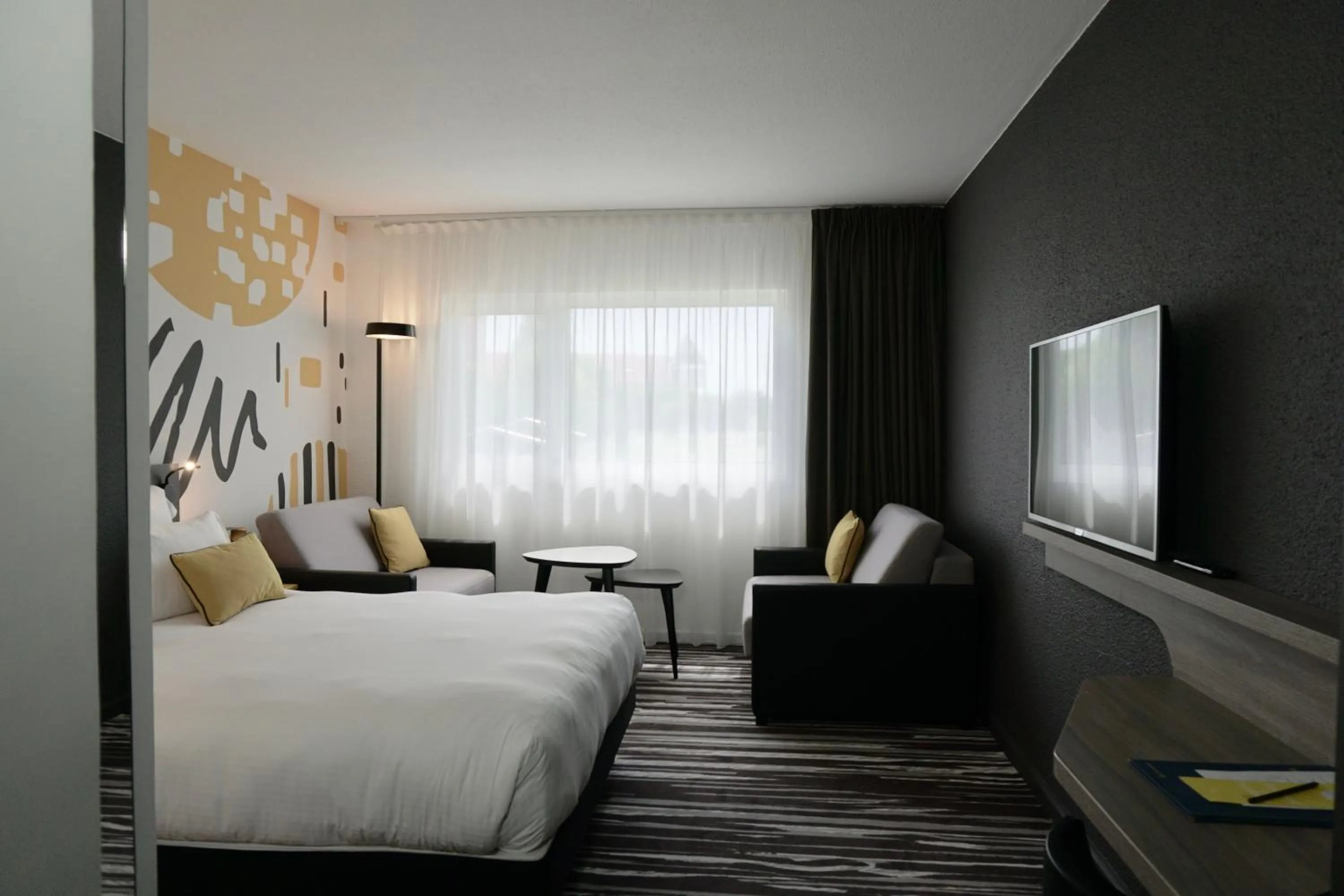 Bed in Golden Tulip Roissy Saint Witz