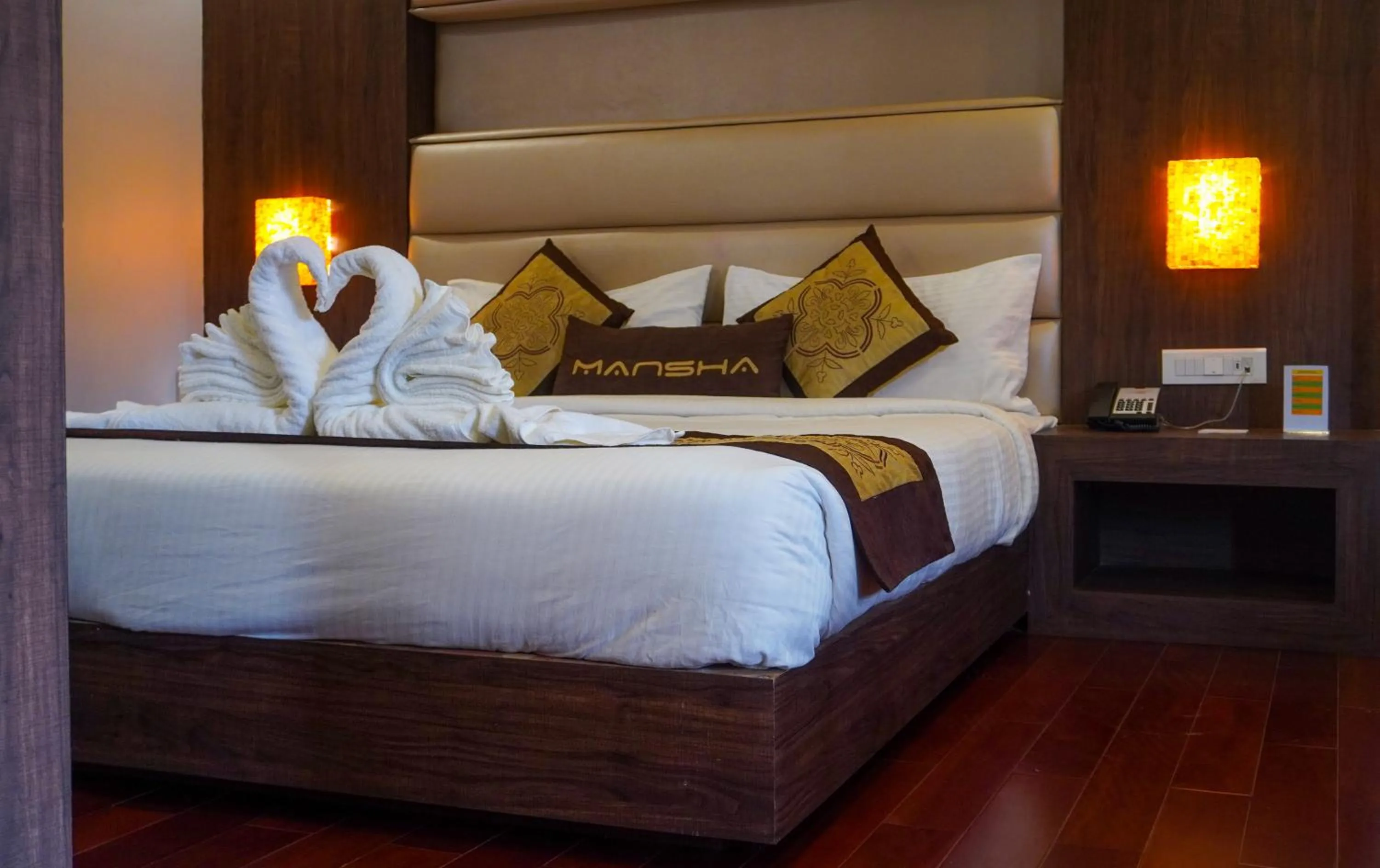 Bed in Hotel Mansha Regency