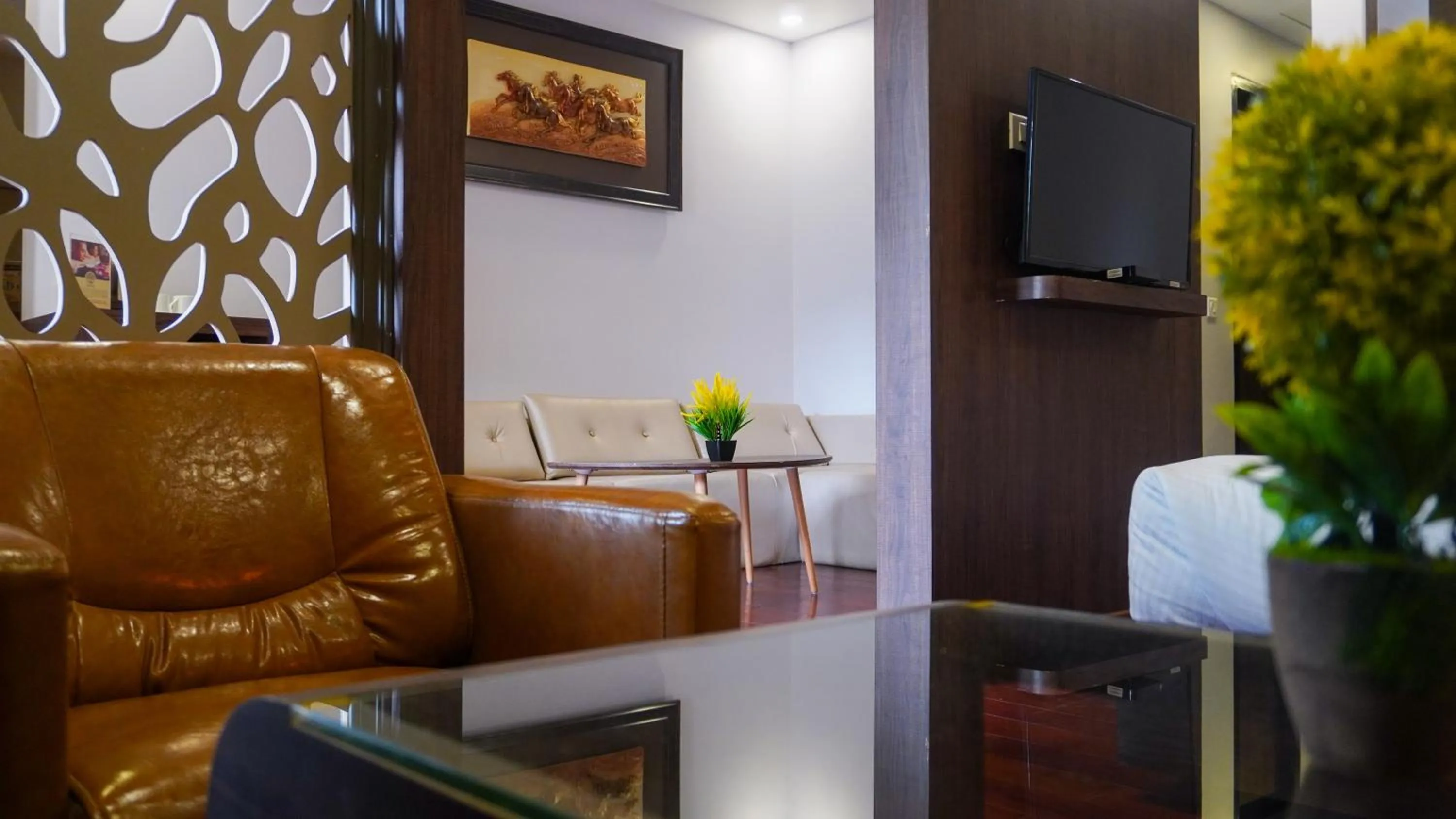 Living room in Hotel Mansha Regency