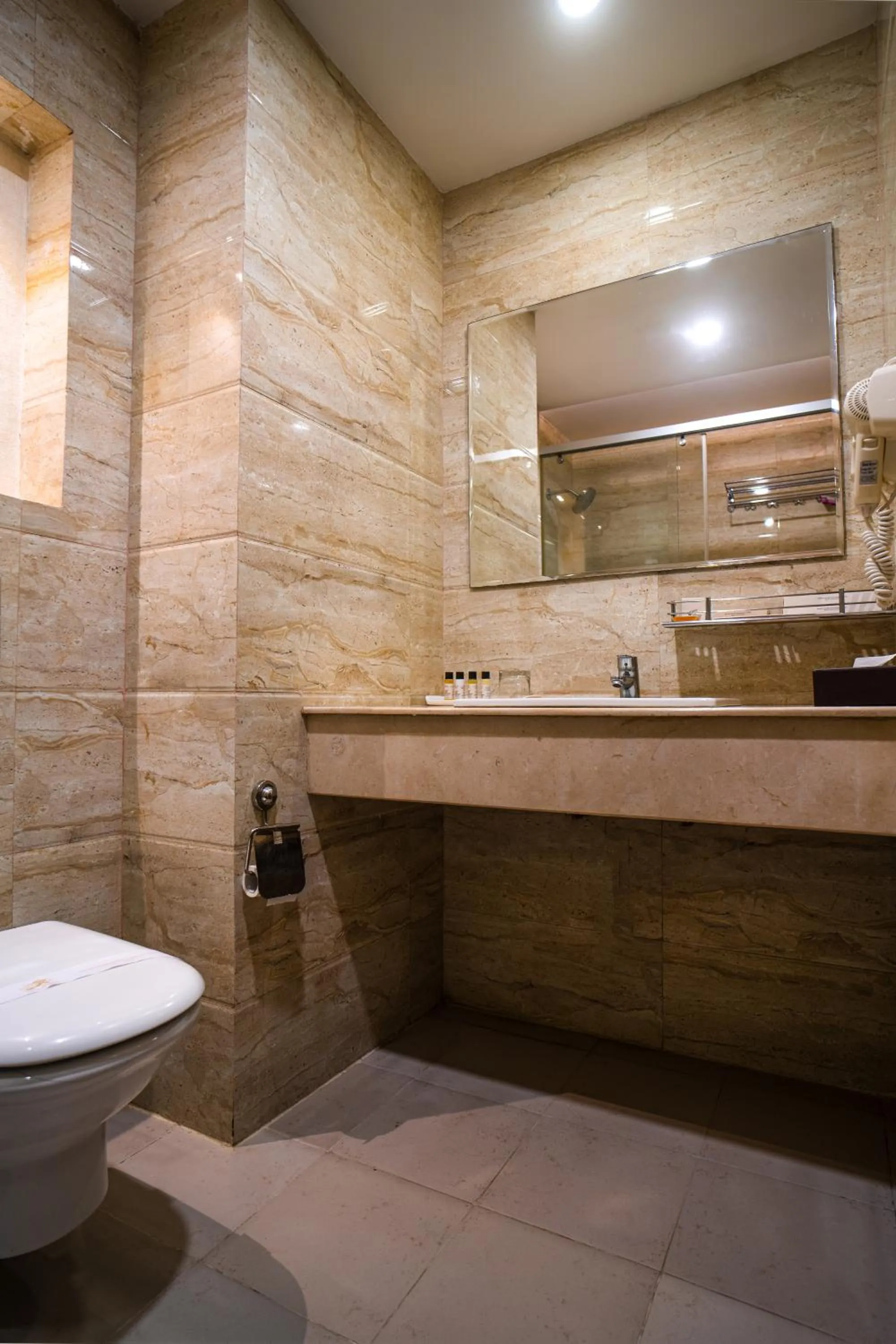 Bathroom in Hotel Mansha Regency