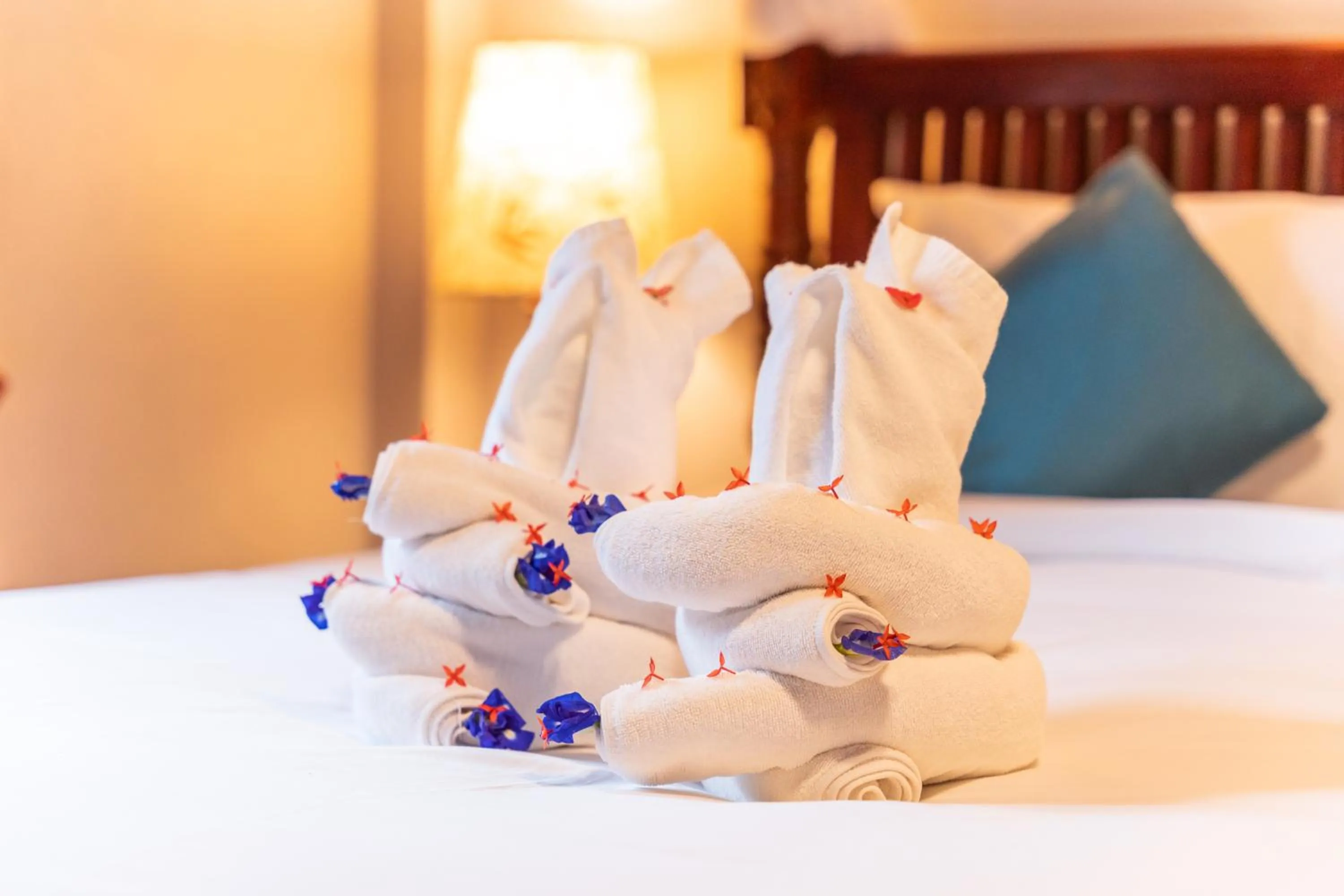 towels, Bed in Muangthong Boutique Hotel