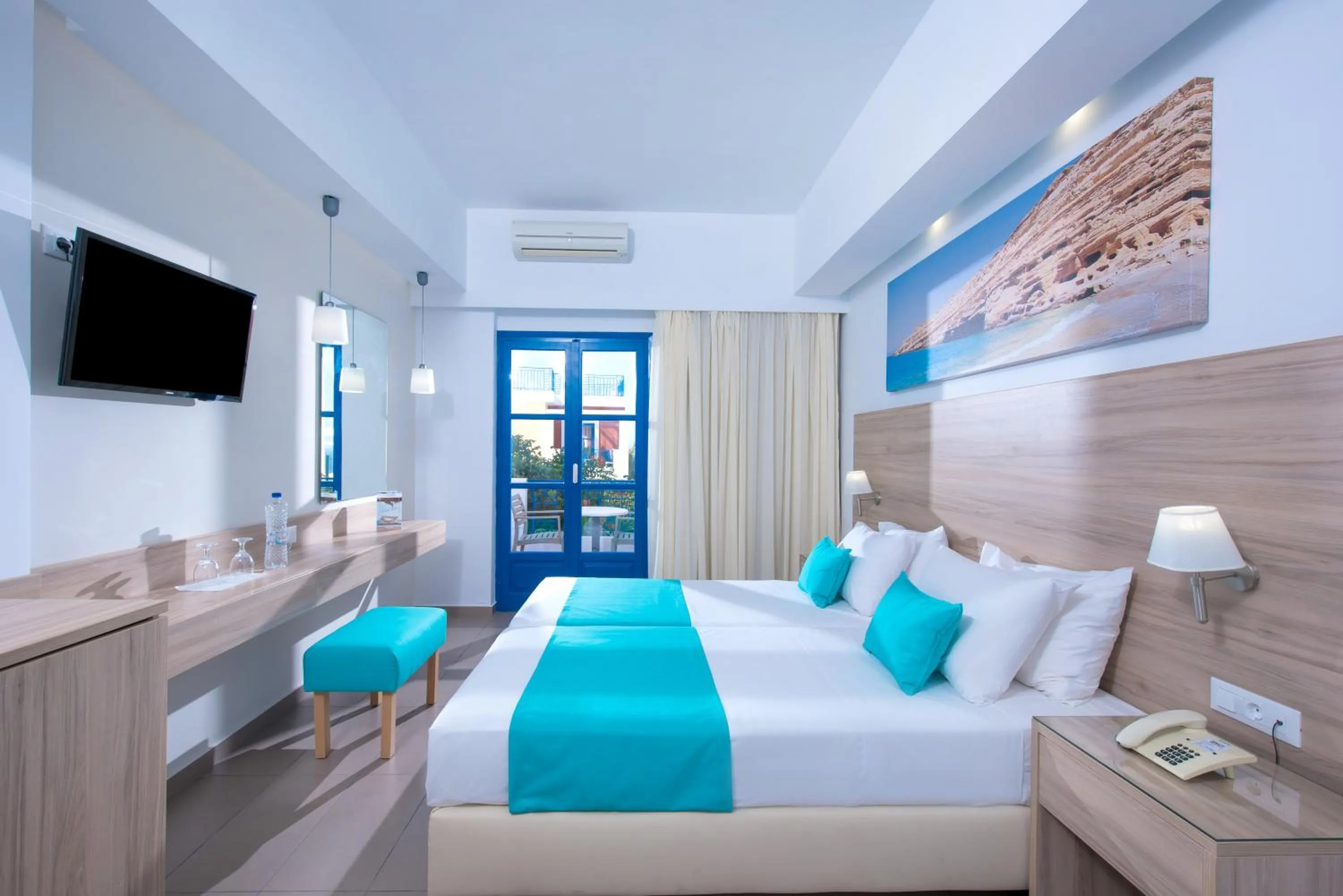 Bed in Astra Village & Suites
