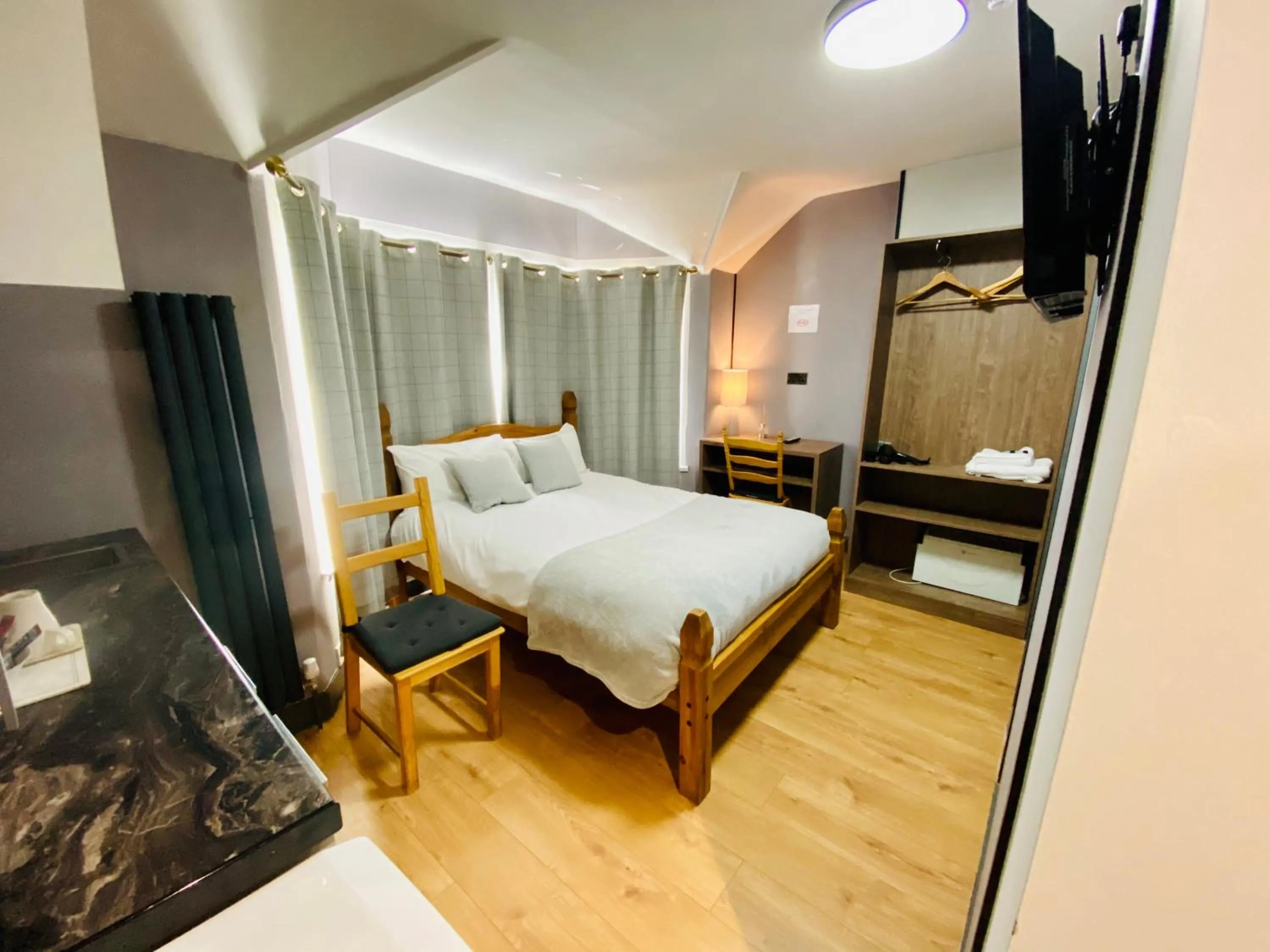 Bed in Hollybush Guest House