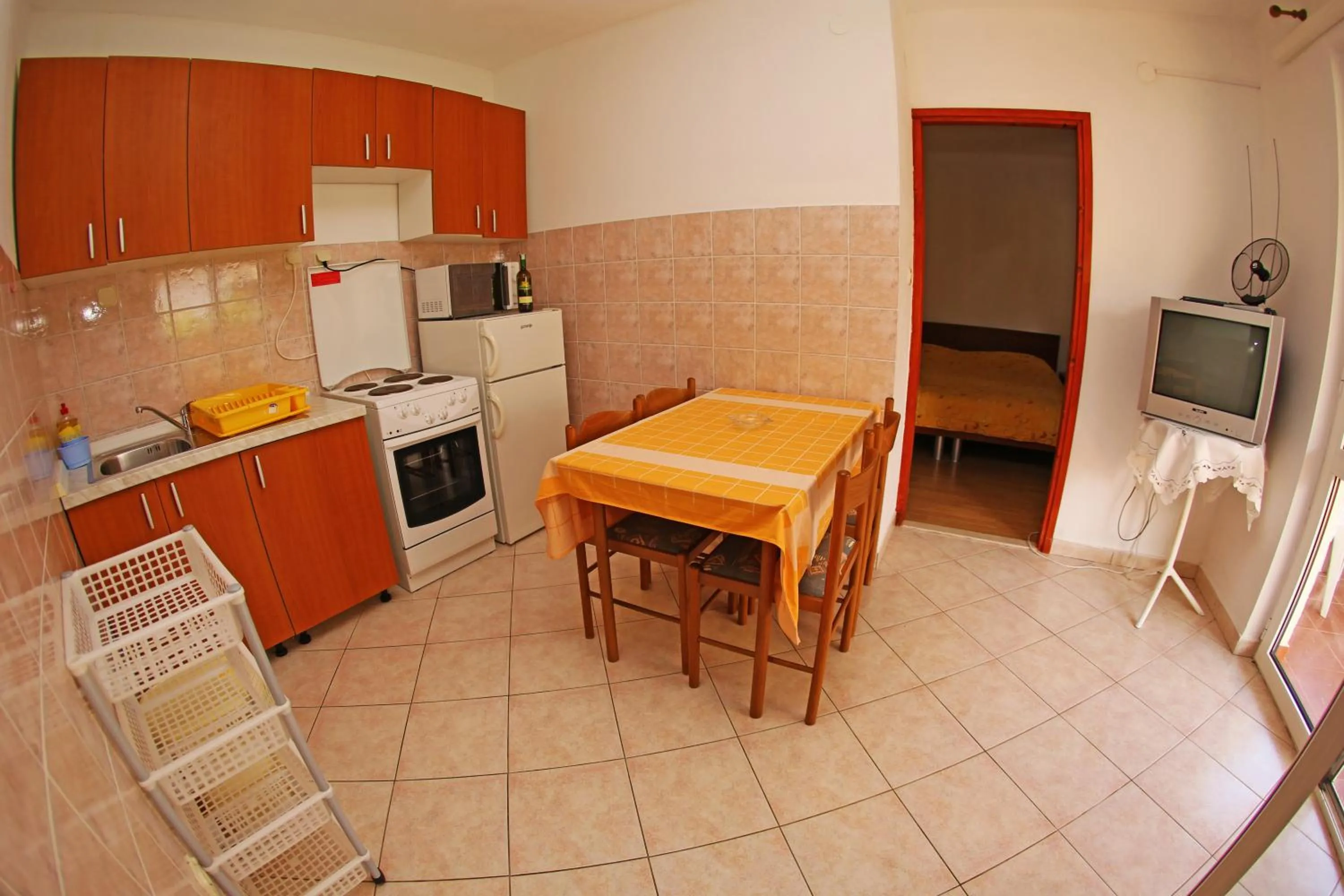 Kitchen or kitchenette in Apartments and Rooms Zvjezdana