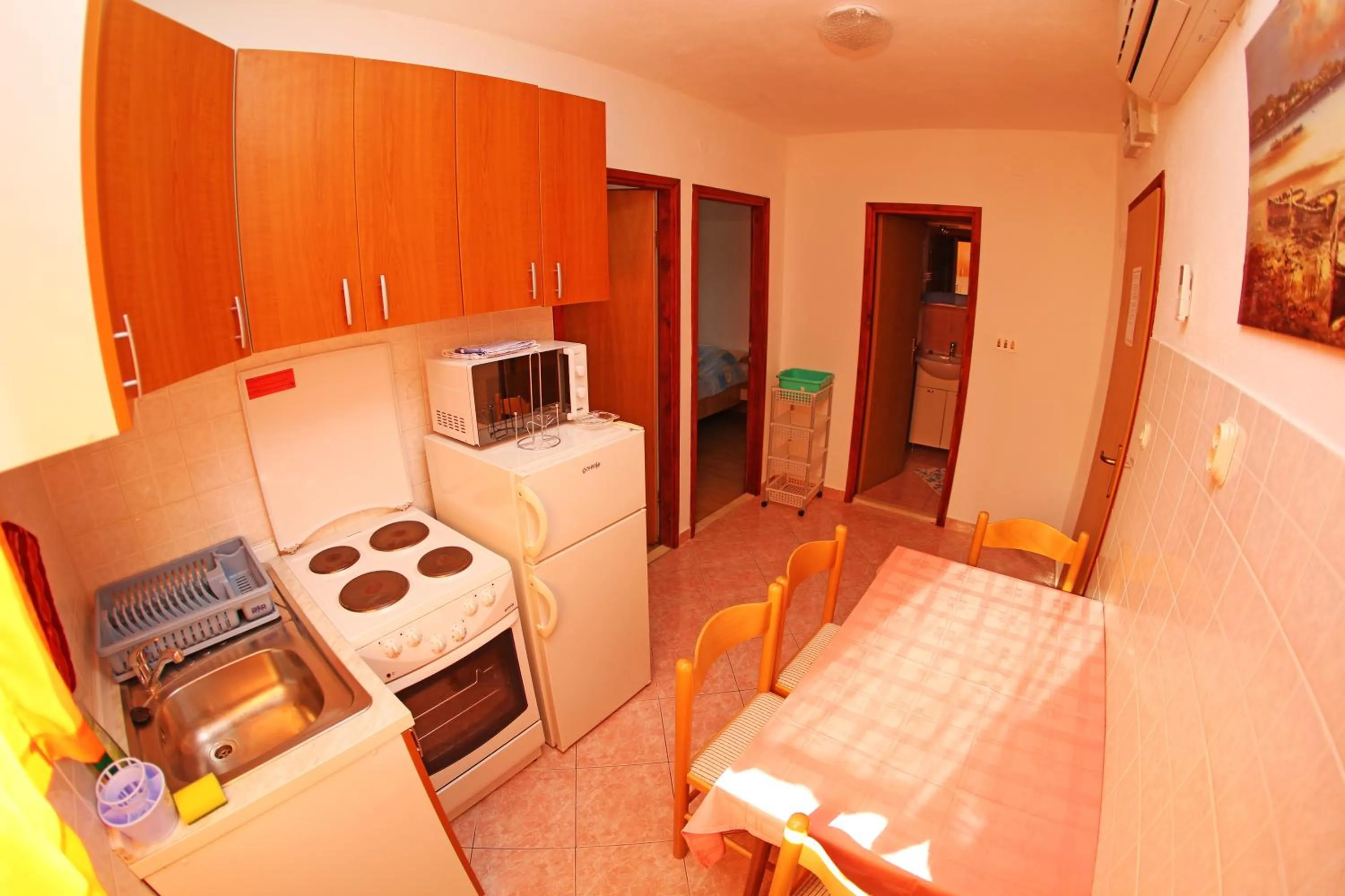 Kitchen or kitchenette in Apartments and Rooms Zvjezdana