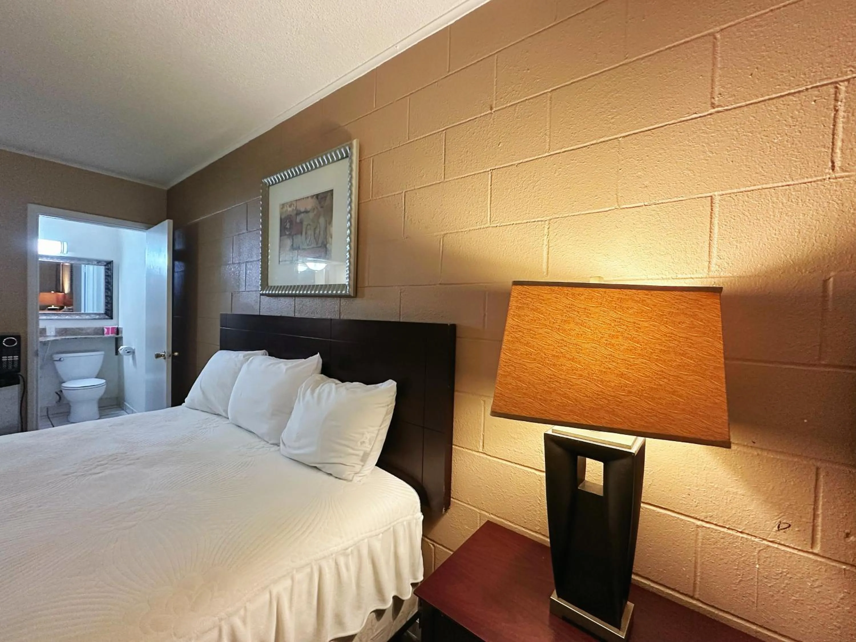 Bed in Royal Inn and Suites