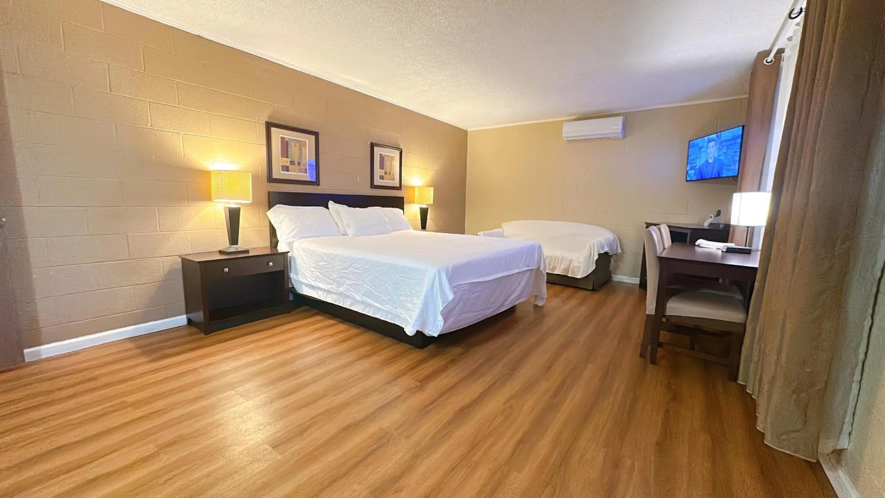 Bed in Royal Inn and Suites